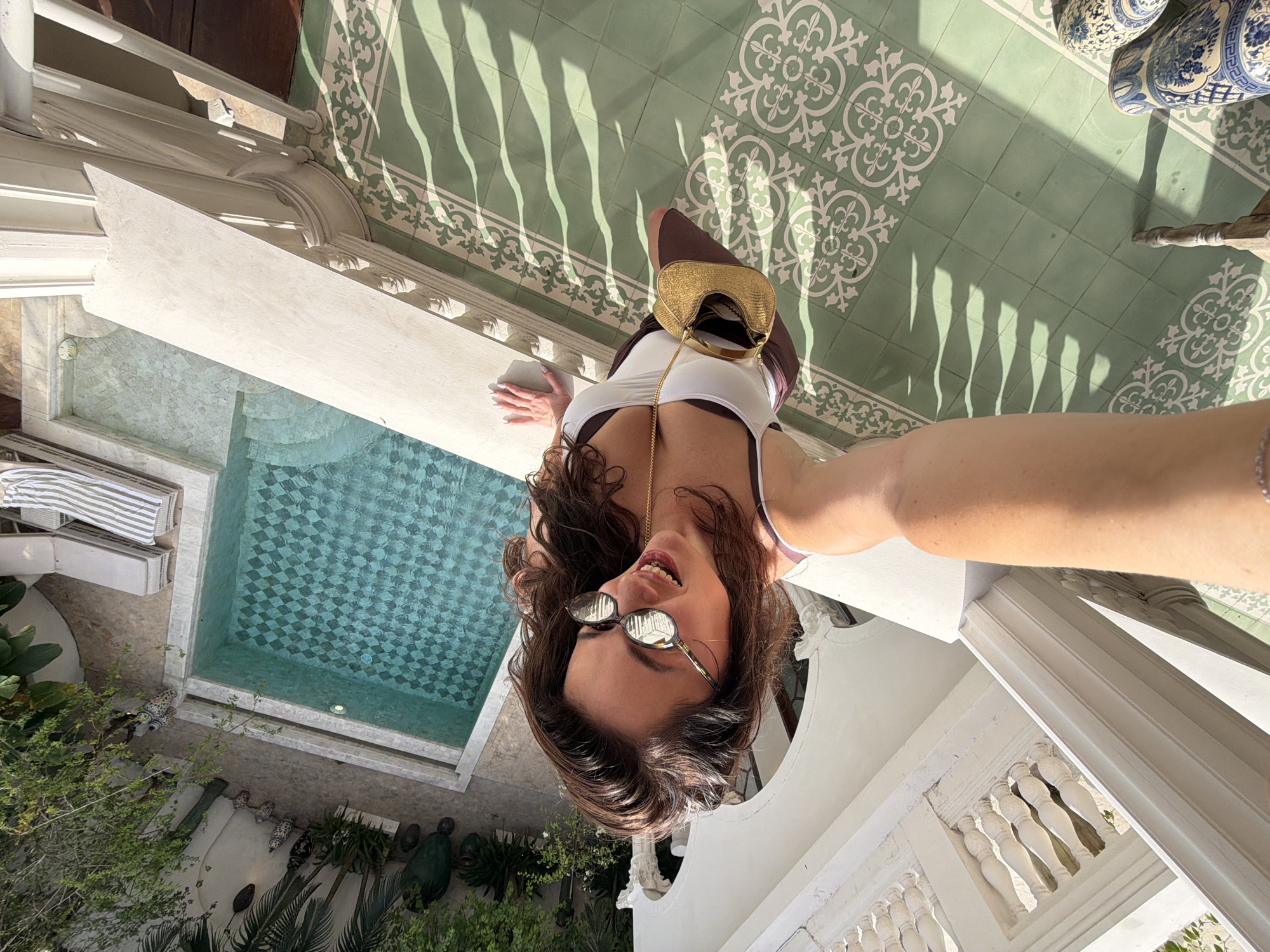 Woman takes selfies from elevated spot in North Kuta
