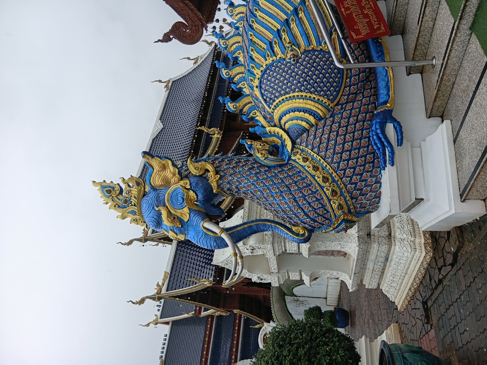 Close look at Wat Ban Den's ornate mythical sculptures and temple facade