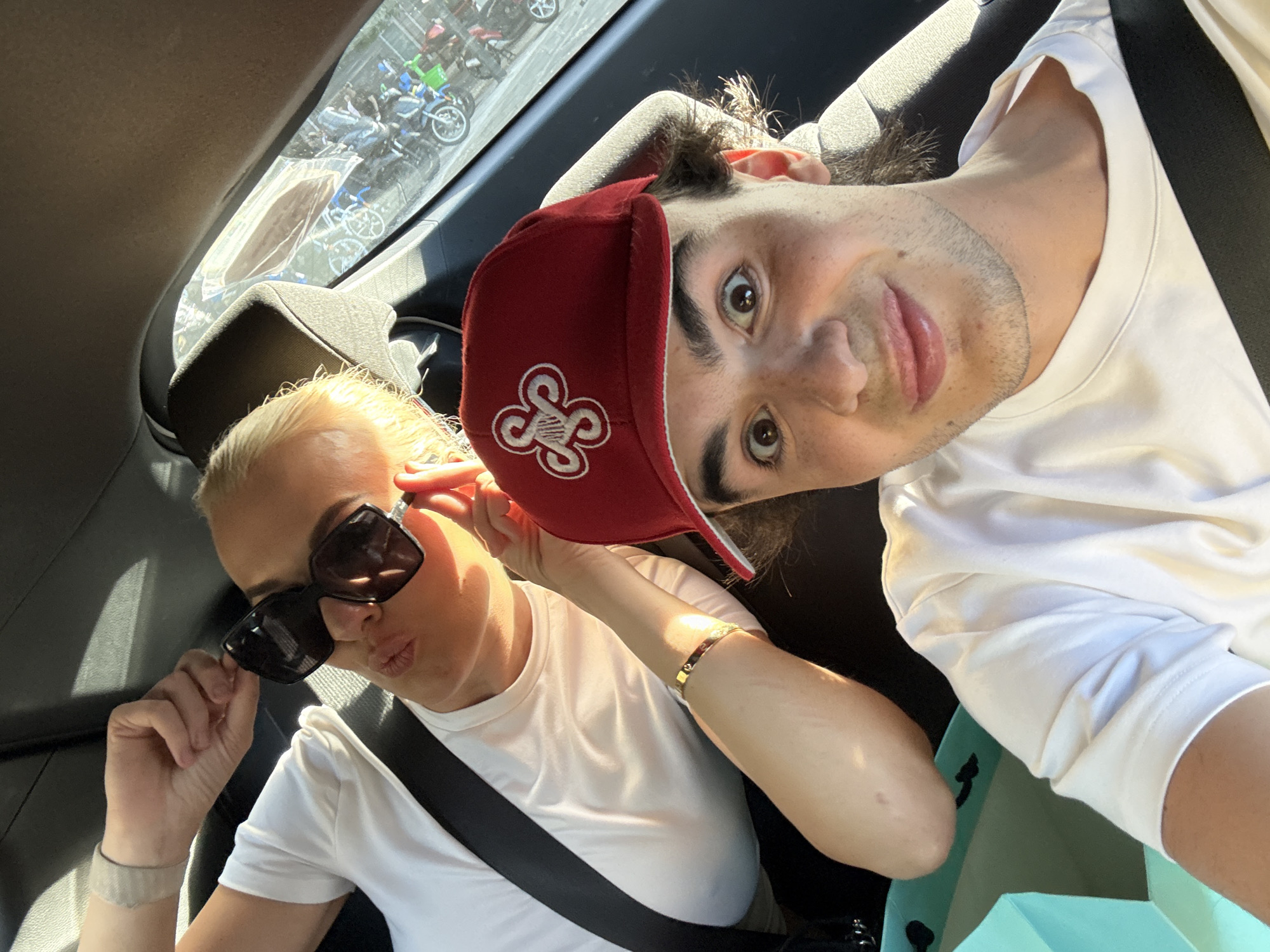 Travelers capture excited selfies in Milan vehicles