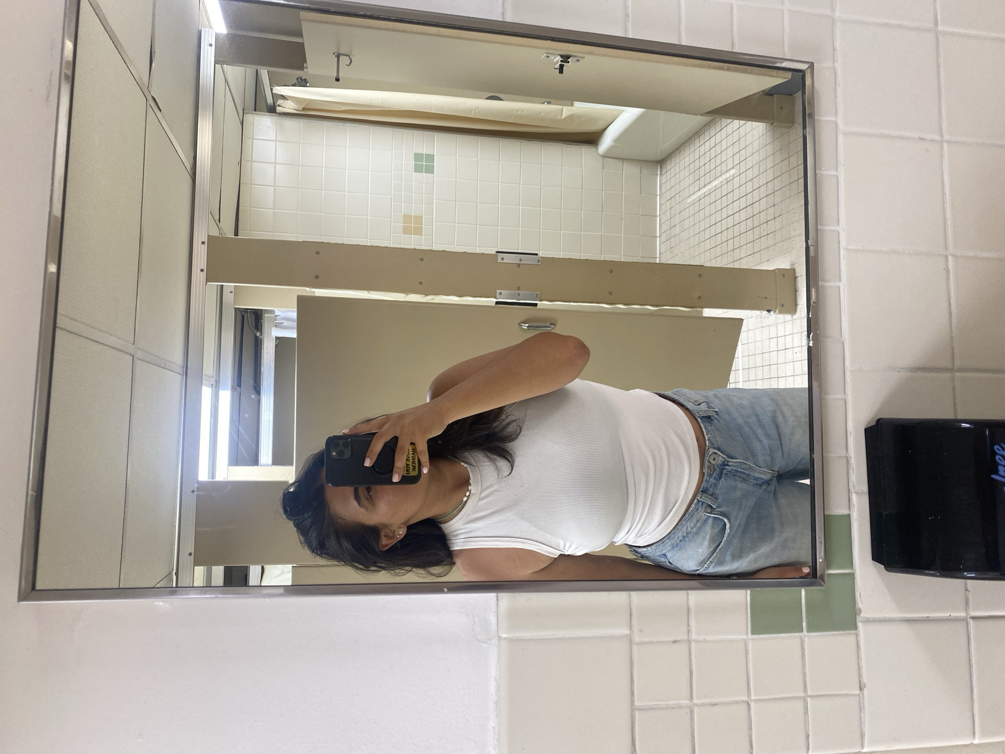 Person spotted in tiled public restroom in New York