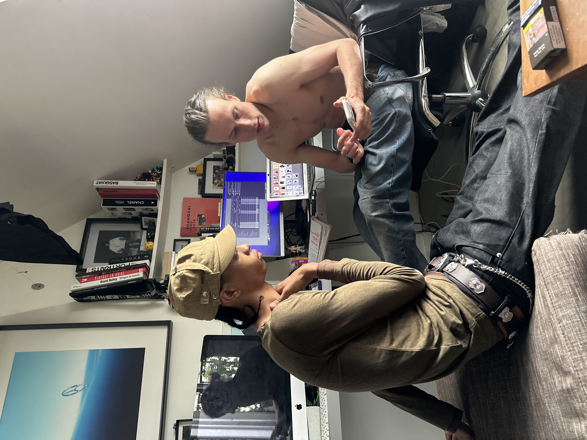 Two people interact casually in Paris apartment during afternoon