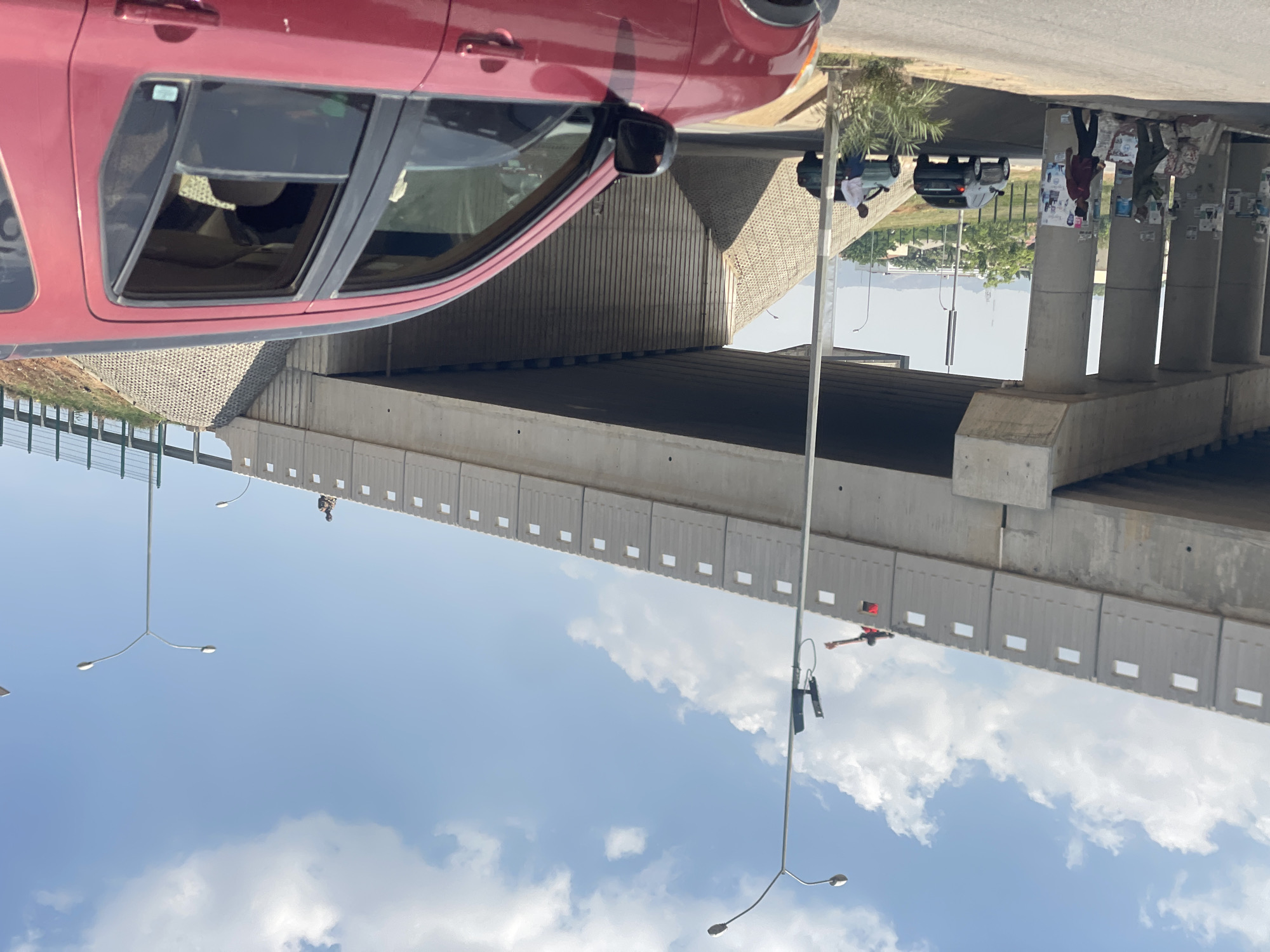 Daytime traffic scene documented at Abuja overpass intersection