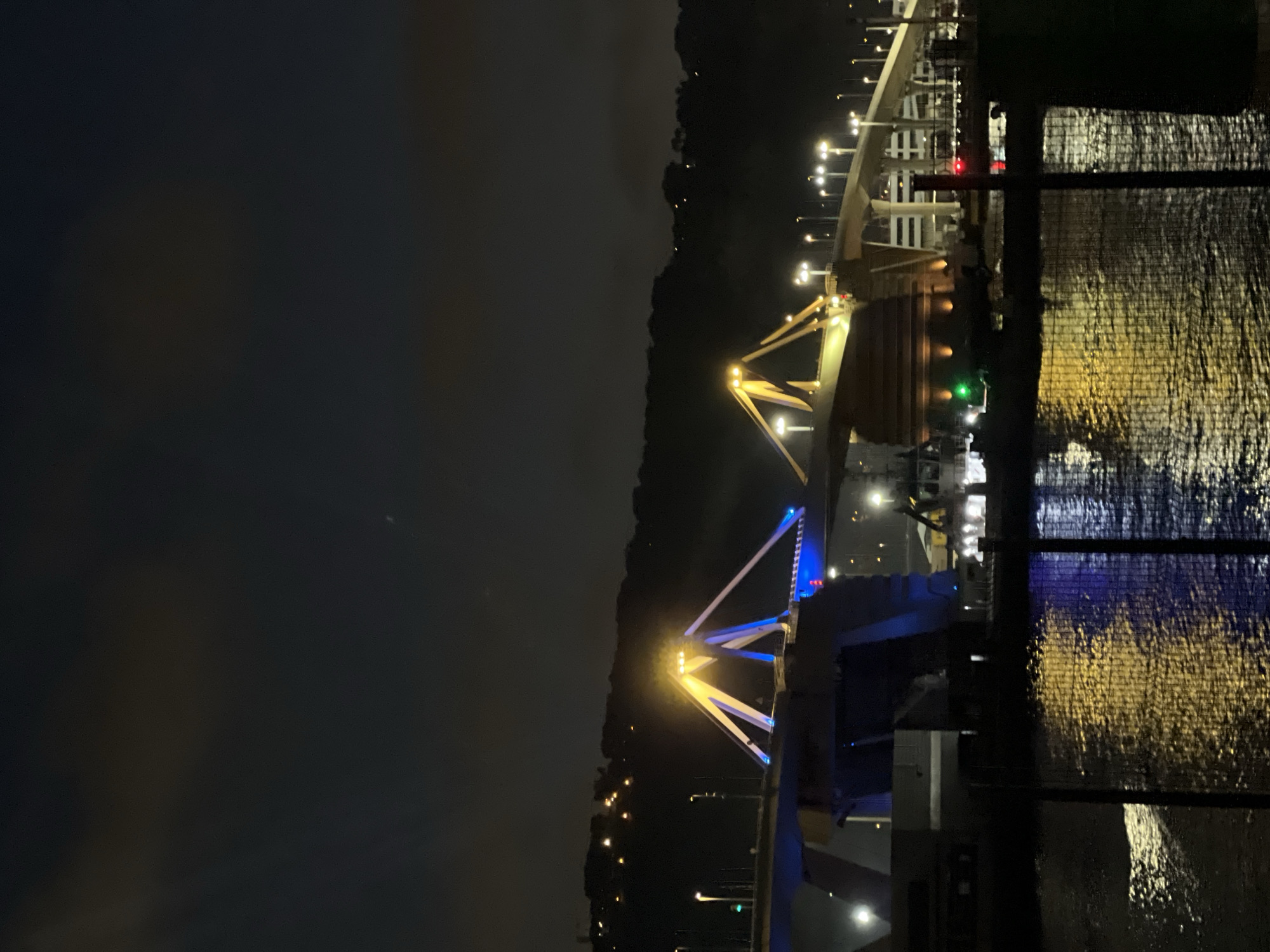Barcelona's Bac de Roda bridge glows under crescent moon