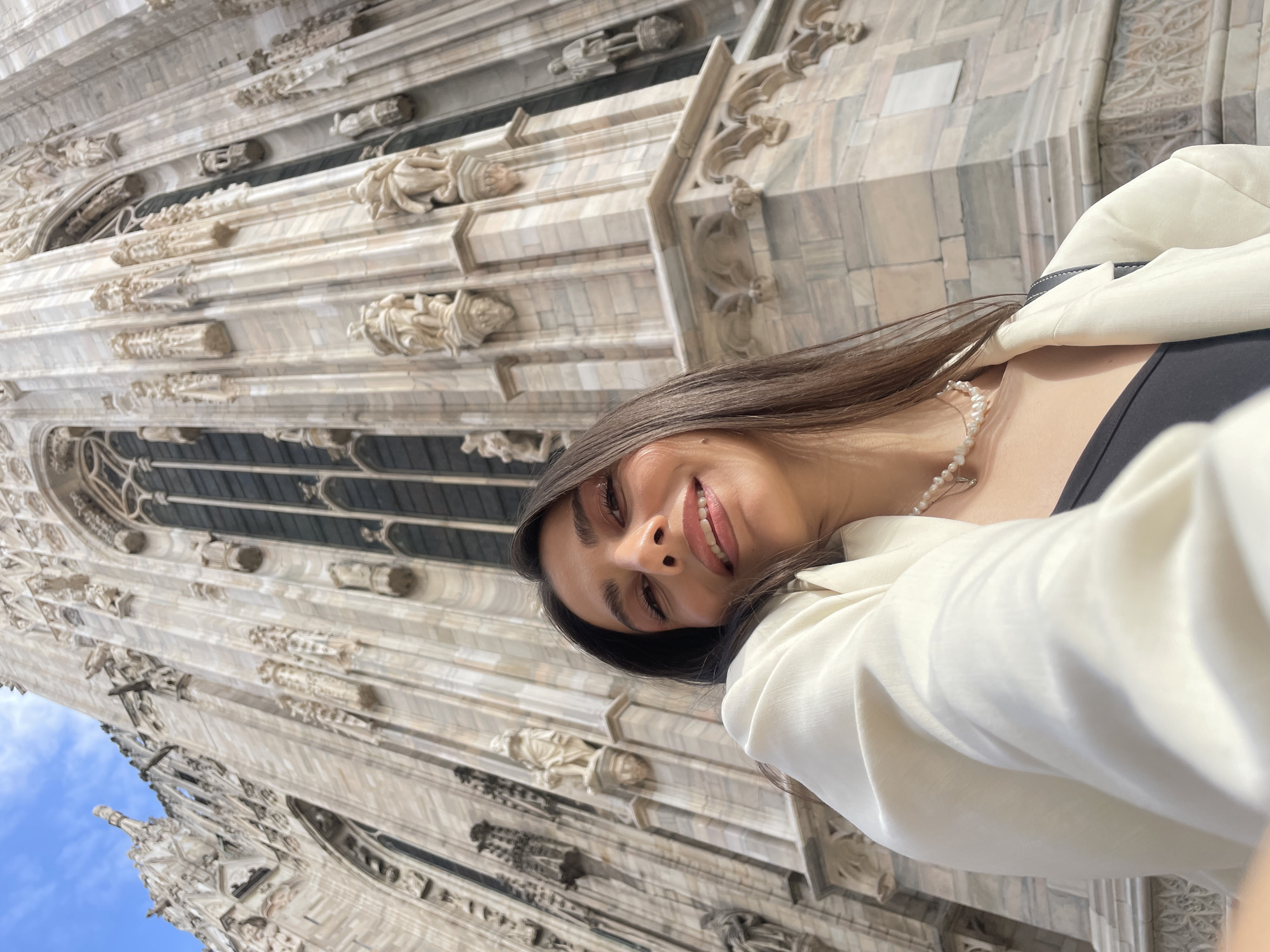 Tourist takes selfies at Milan Cathedral during afternoon visit