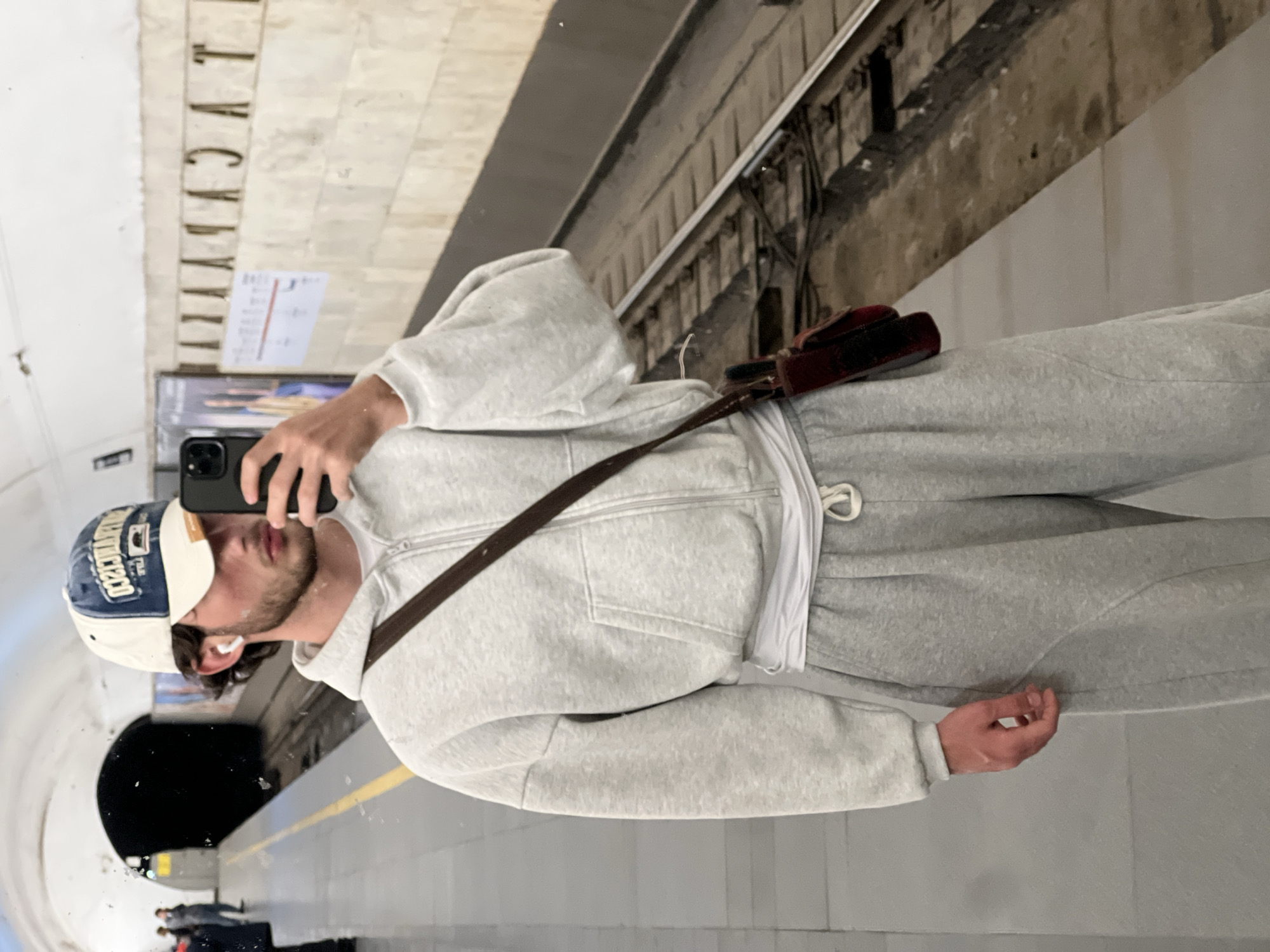 Man takes selfie using reflections in Yerevan Metro station