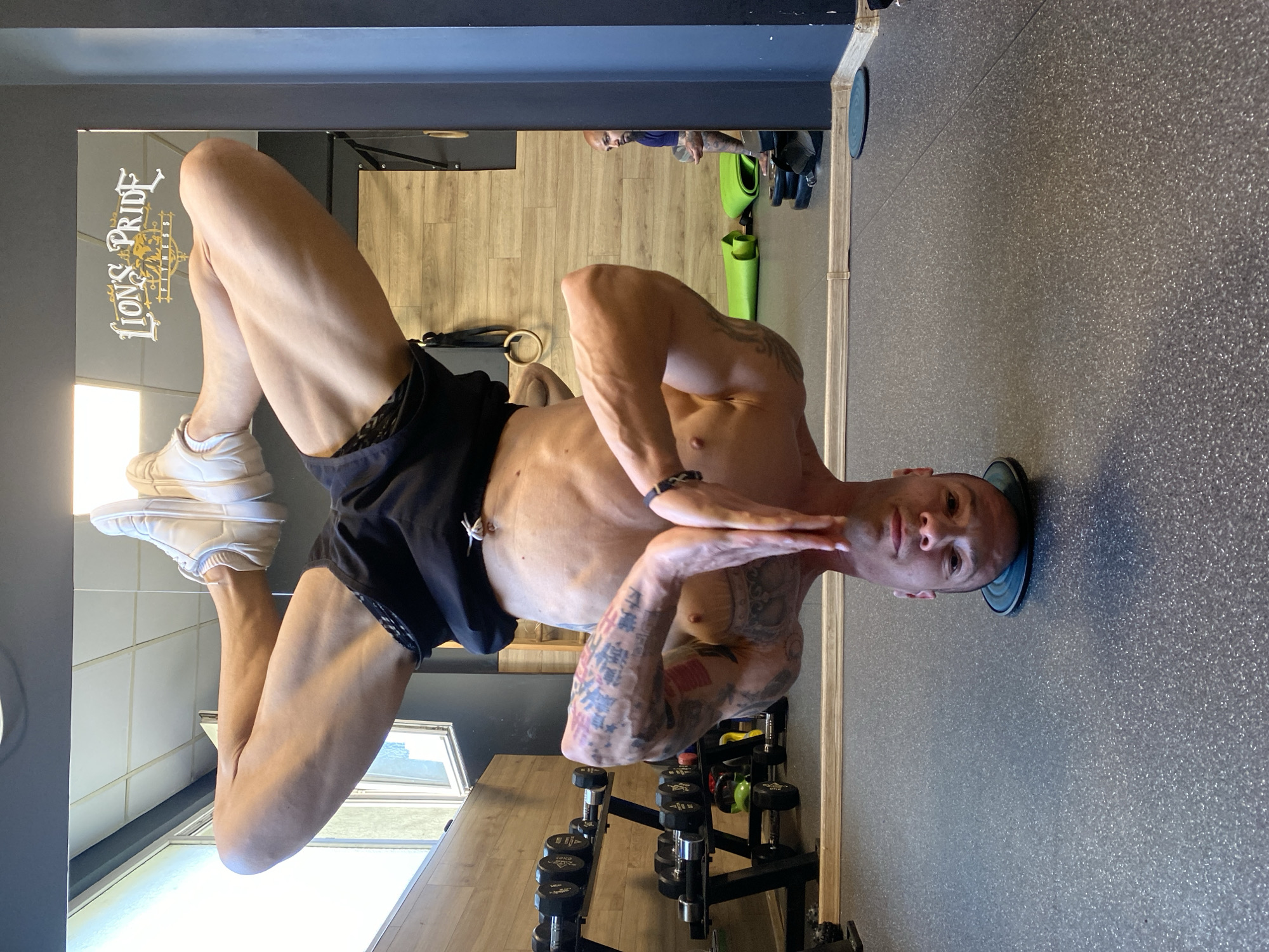 Man performs headstand exercise at Pleven gym