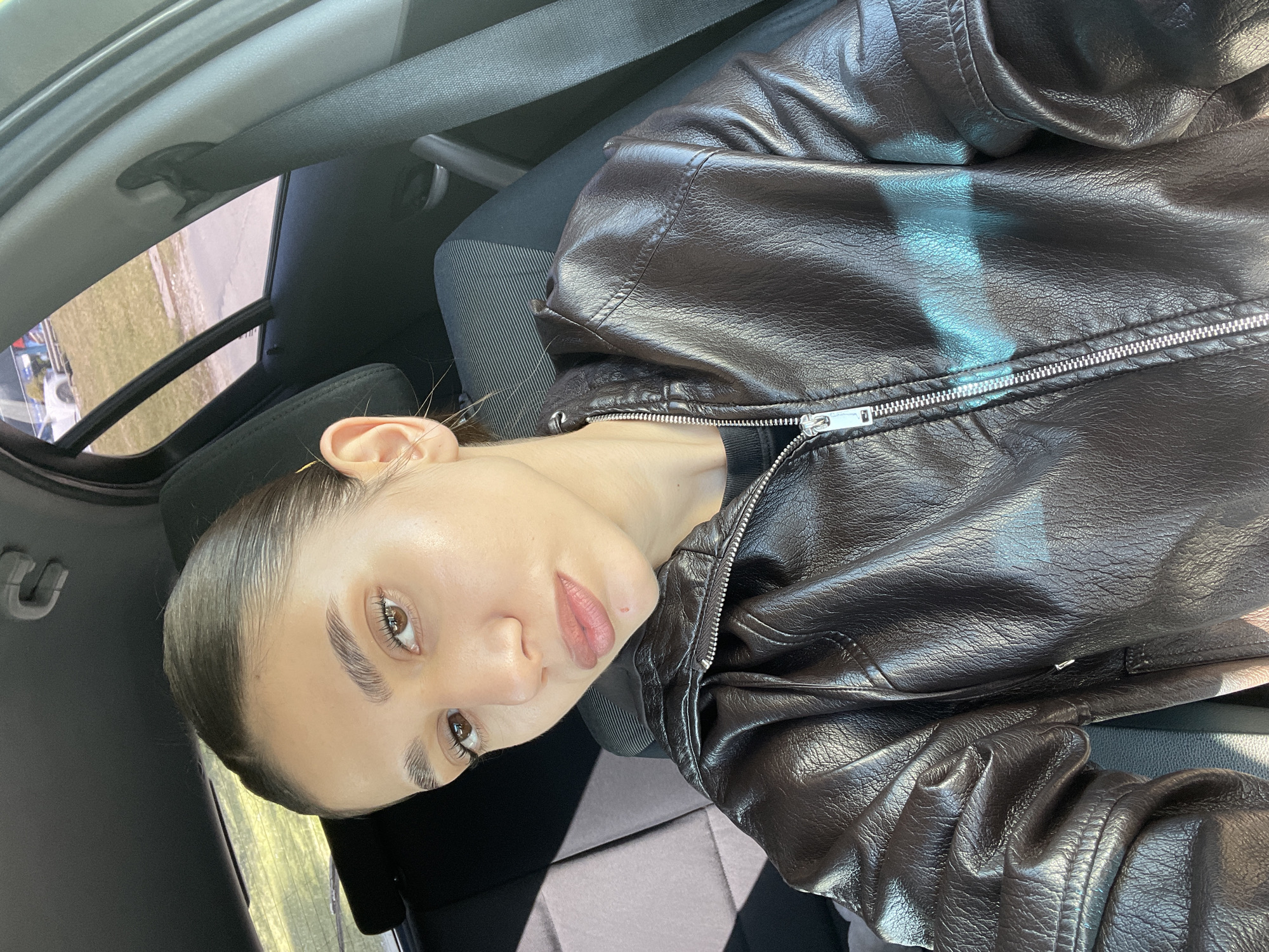Woman in leather jacket observed in car in Sofia
