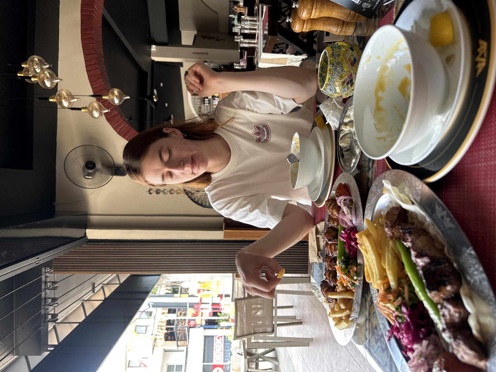 Woman dines at restaurant in Baan Chaweng, Thailand