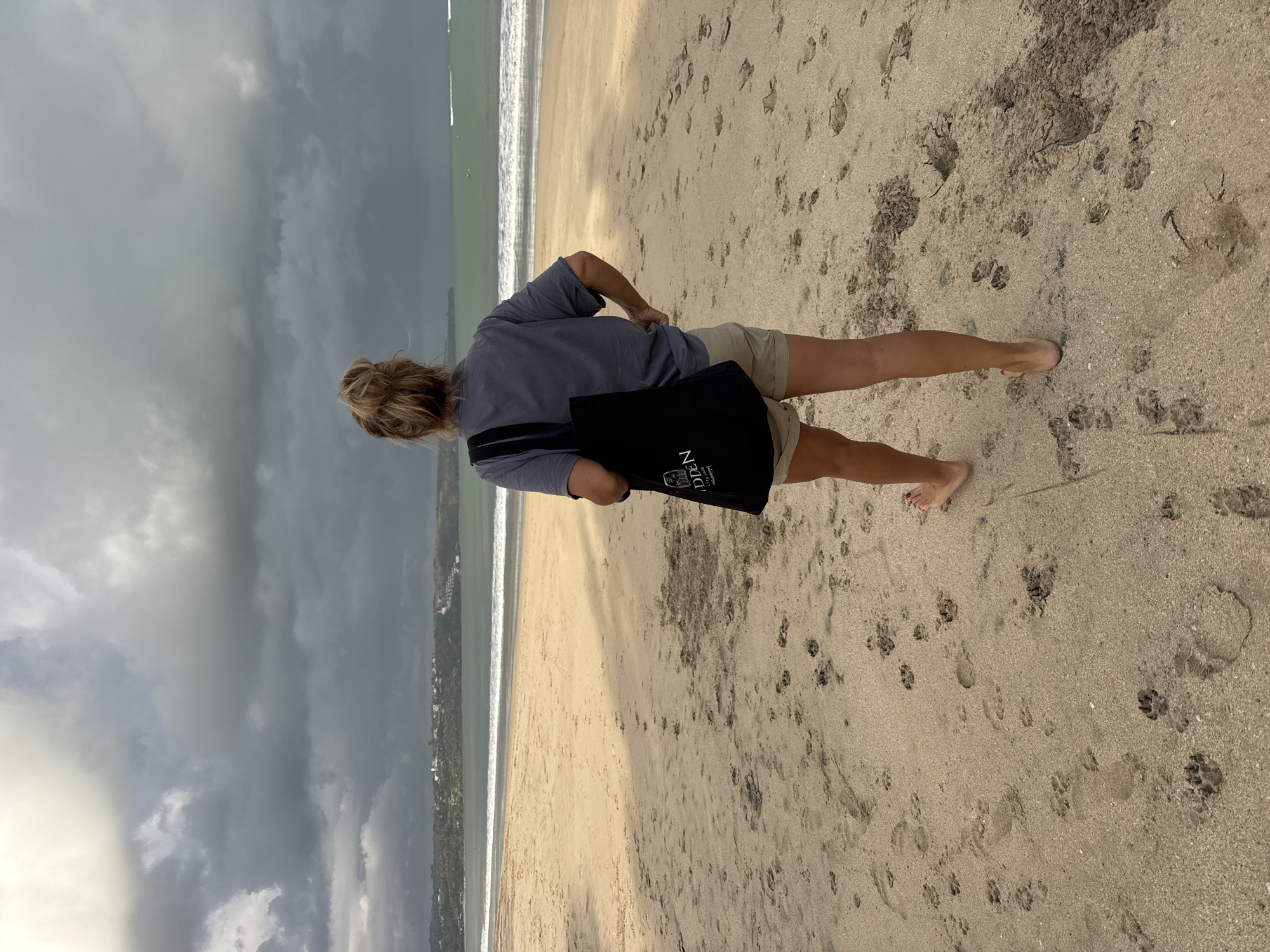 Jumping and posing on a moody Kuta Beach afternoon