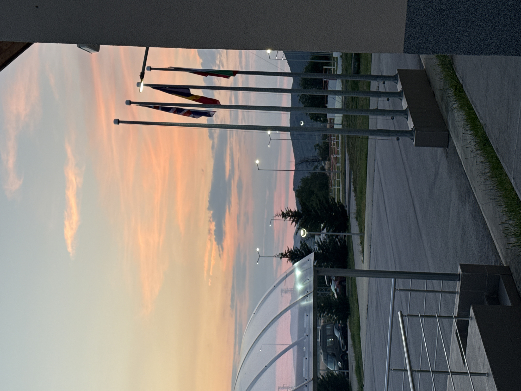 Evening joggers and sunset watchers documented in unknown city