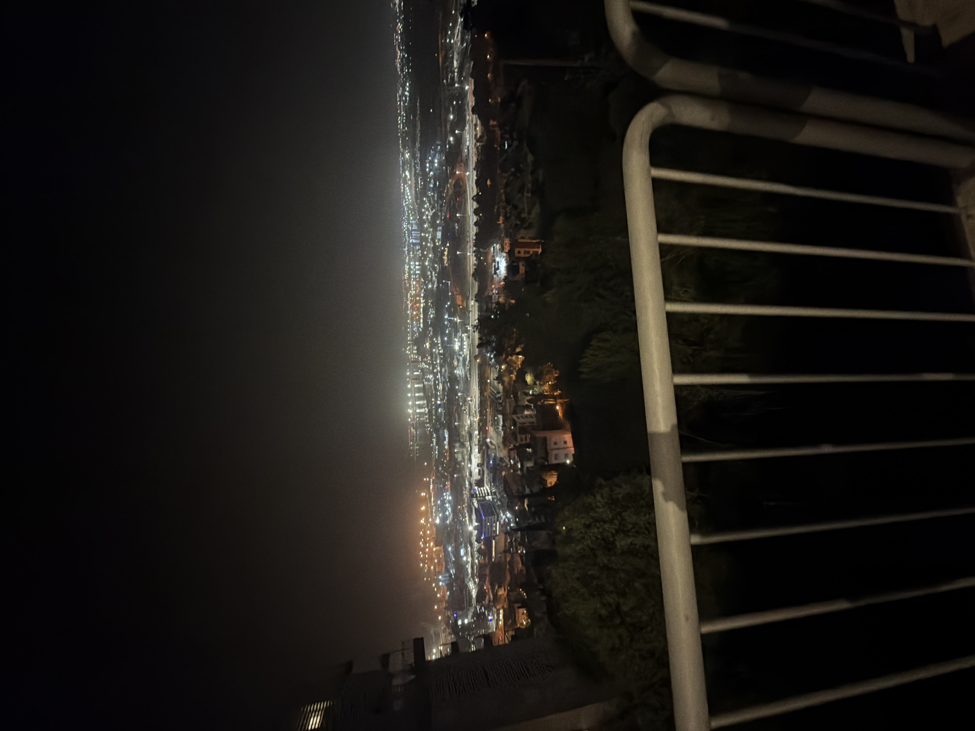 Nighttime aerial view captured of illuminated Haifa cityscape