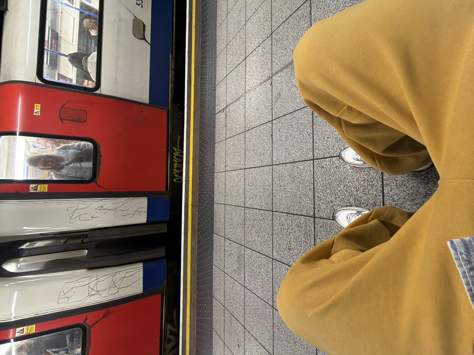 Commuter in yellow tracksuit spotted at London Underground station