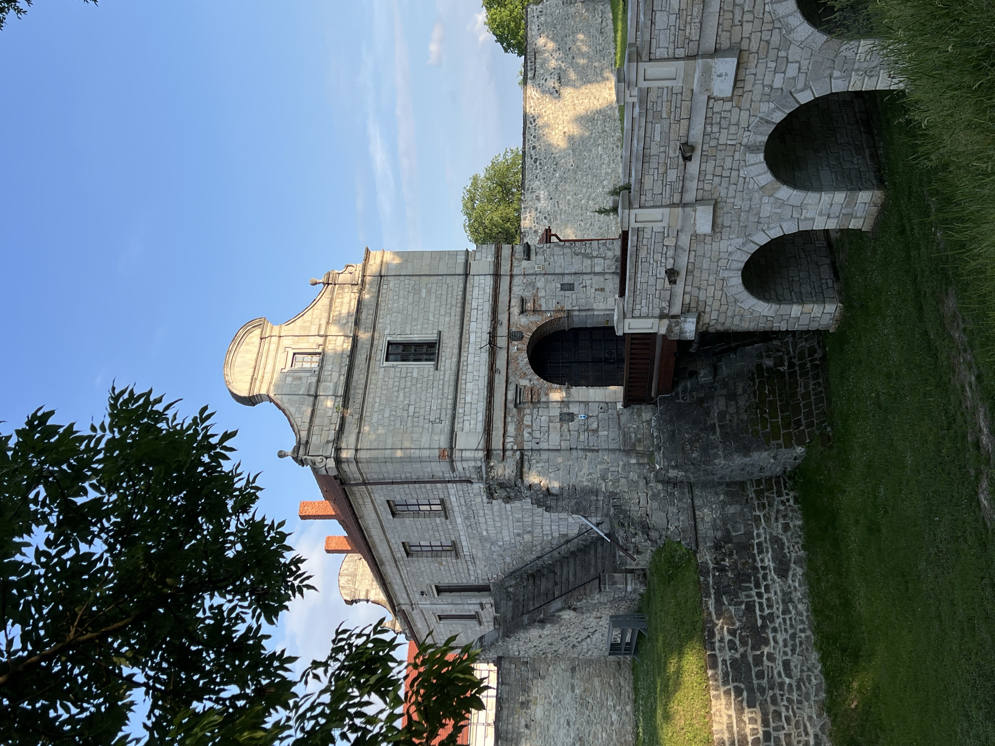 Tourist documents historic Zbarazh Castle during sunny afternoon visit