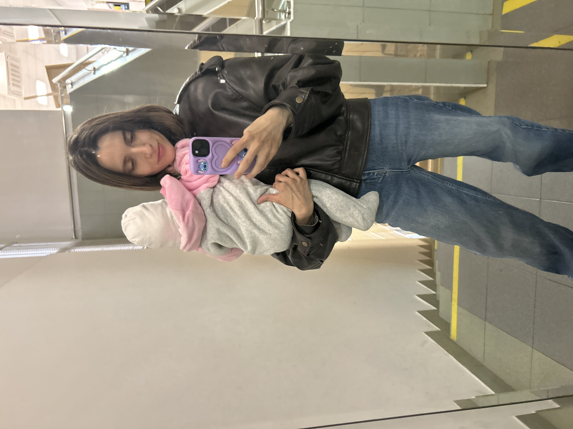 Woman photographs herself with baby in Moscow mirror