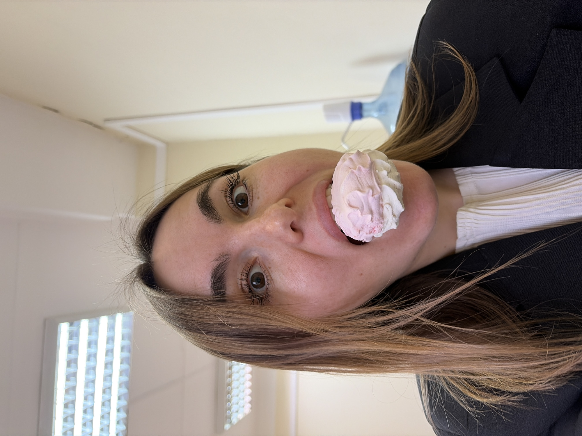 Woman poses with meringue treats in Izhevsk candy shop