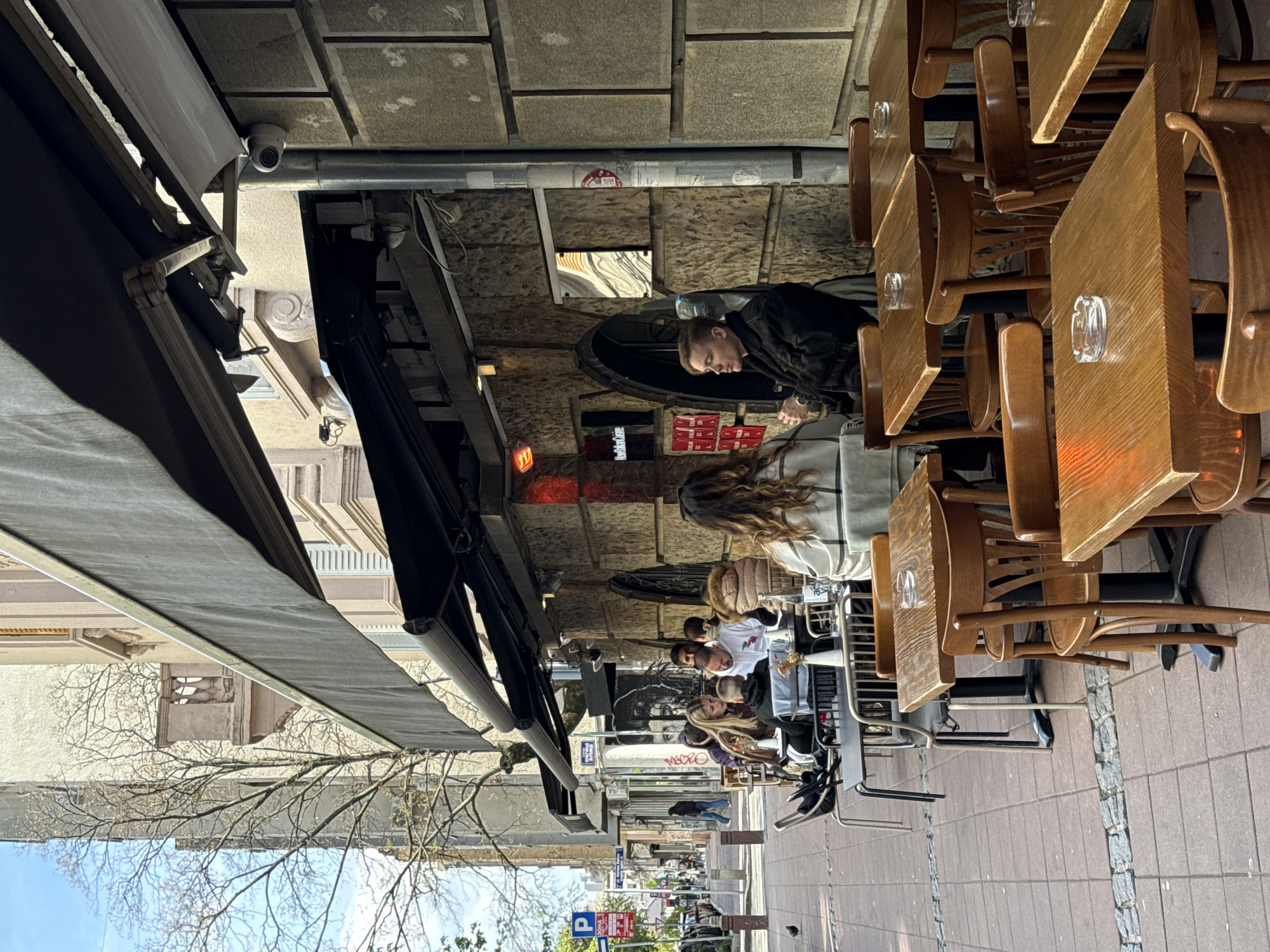 Saturday afternoon cafe scene documented in Belgrade streets