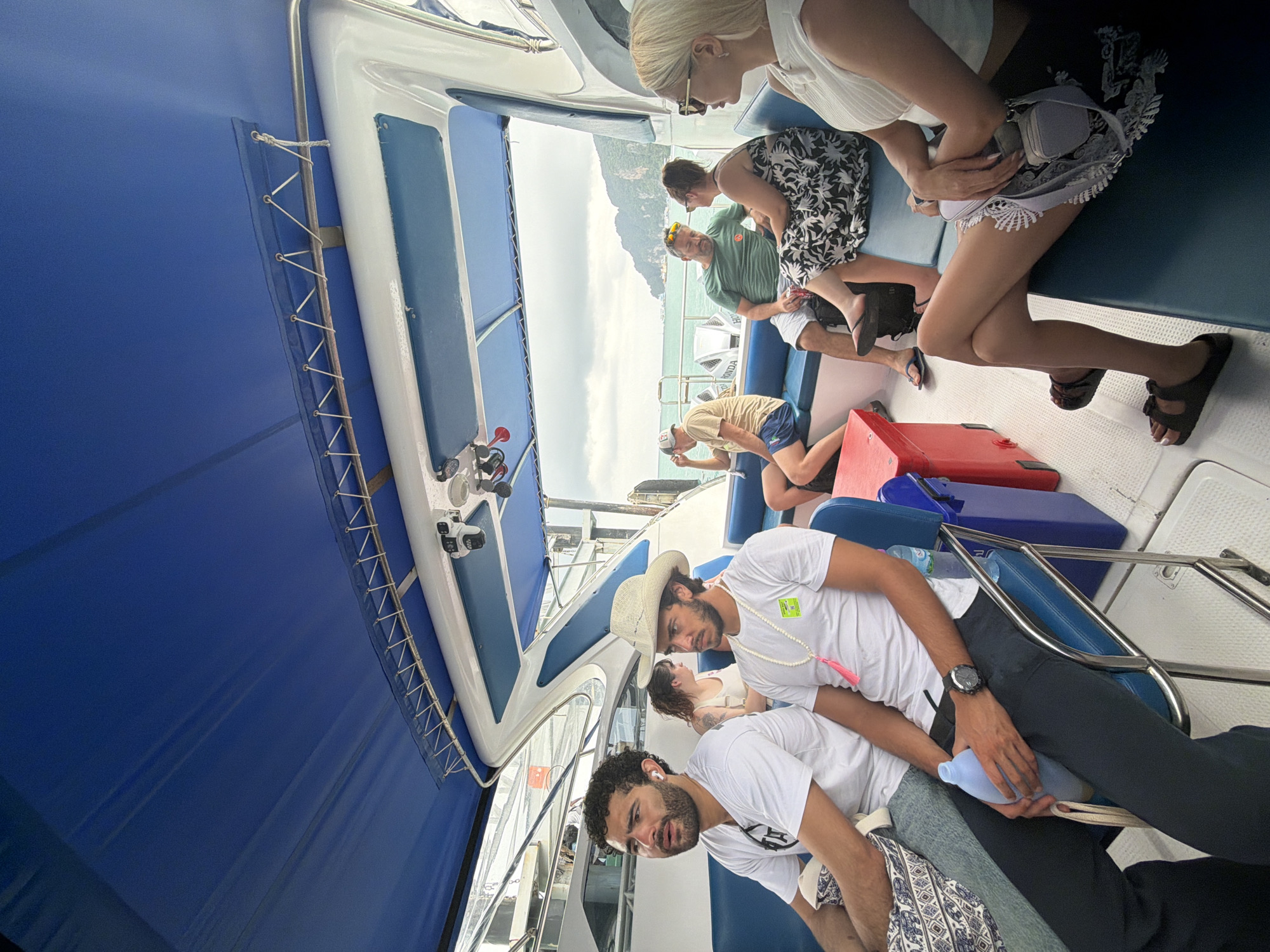 Ao Nang harbor morning: boats, divers, and dockside cats