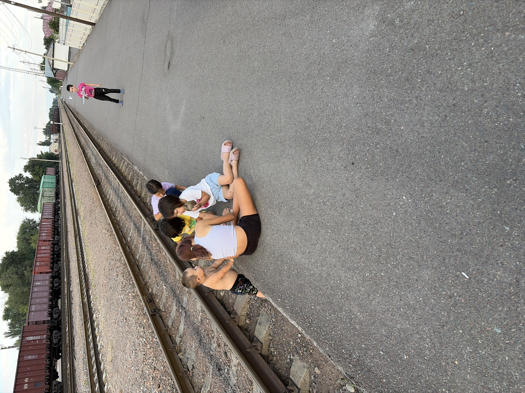 Freight train activity and trackside life in Kant, Kyrgyzstan