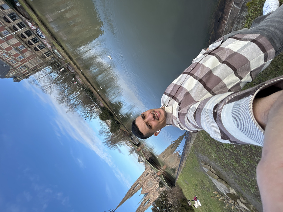 Tourist documents solo walking tour through historic Strasbourg landmarks