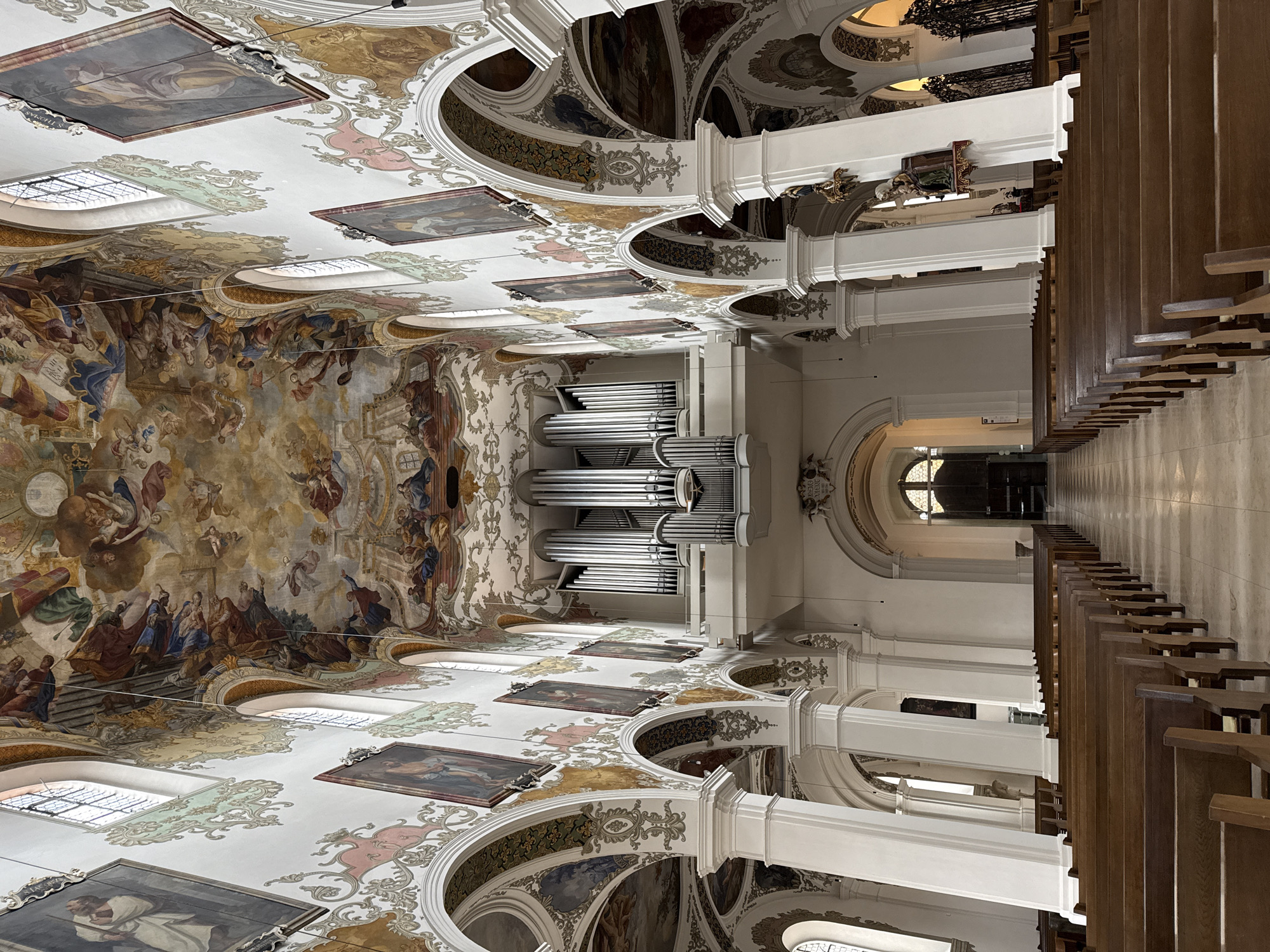 Visitors photograph baroque St. Martin Church interior in Germany