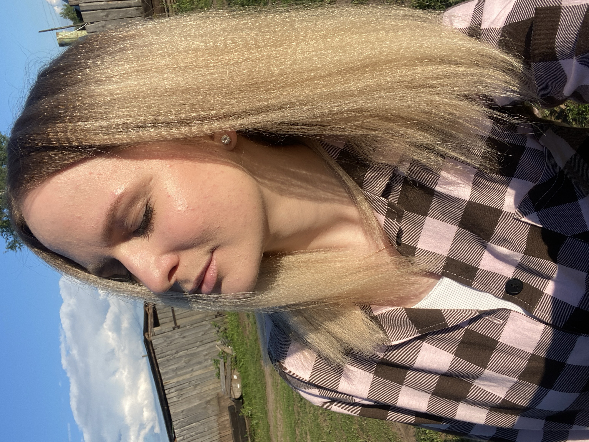 Woman captures outdoor selfies in Kauchuk Stantsiya, Russia