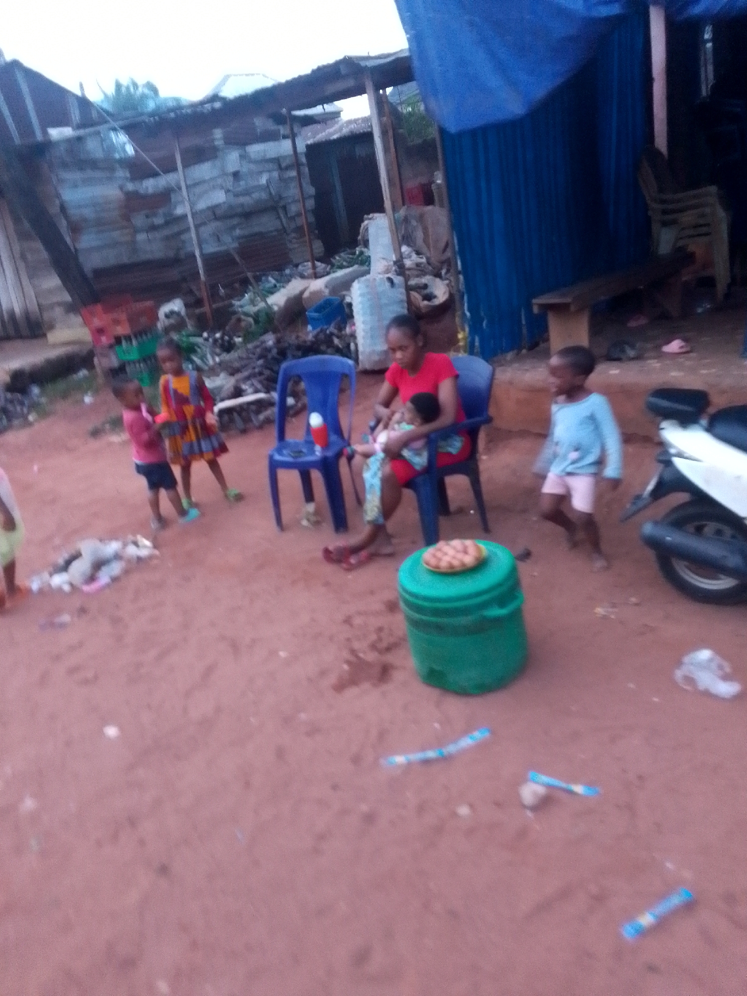 Daily life documented across Orlu streets during overcast afternoon