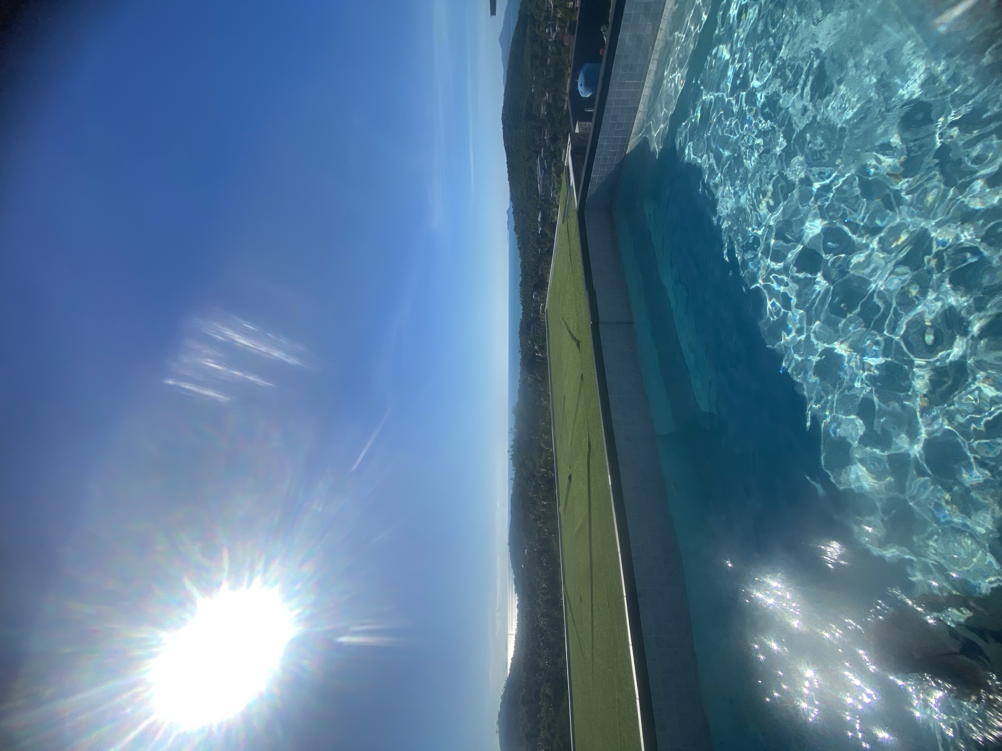 Infinity pool views and stormy palms in Baan Tai