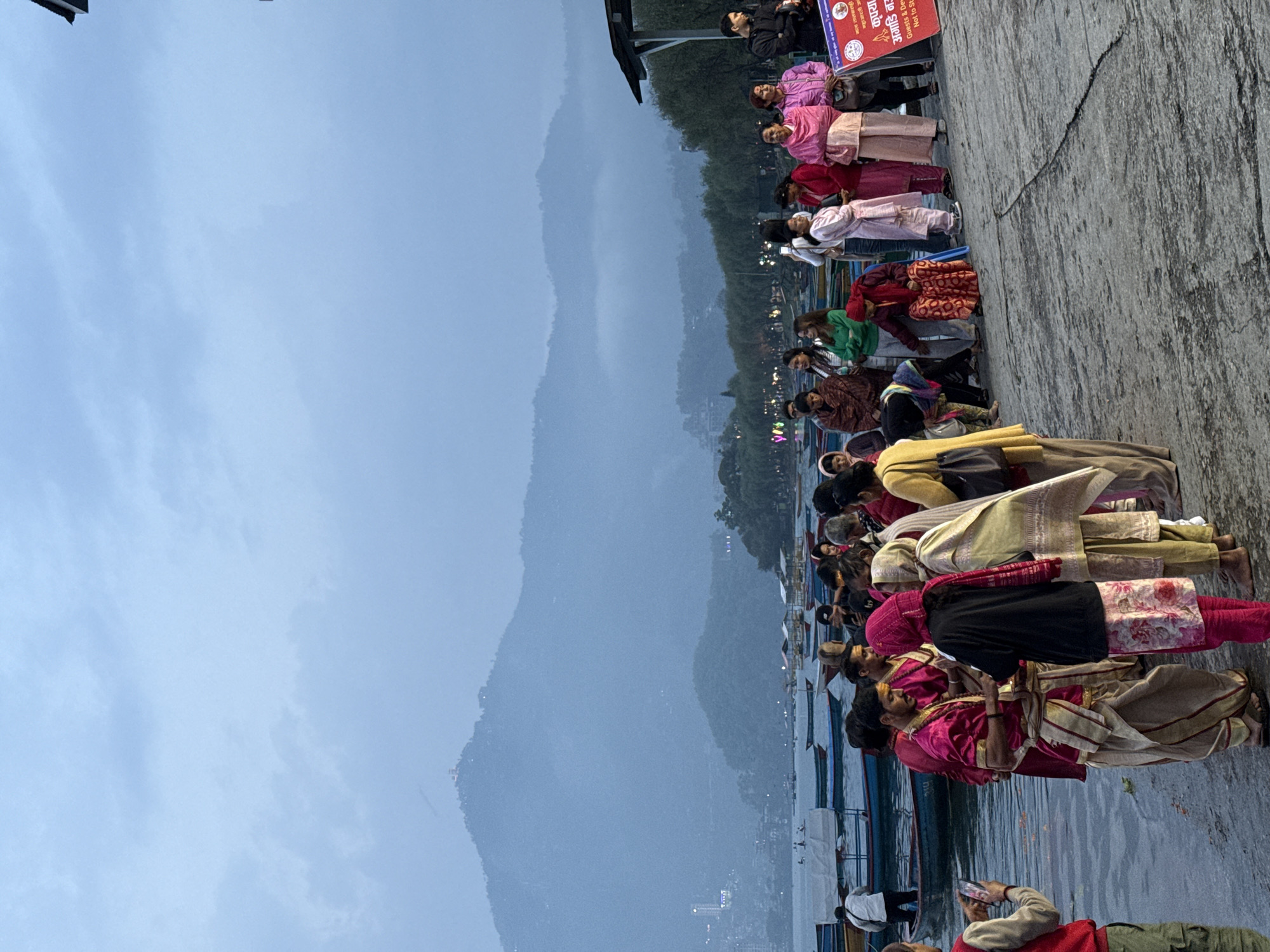 Boating activity captured on misty lake in Pokhara, Nepal