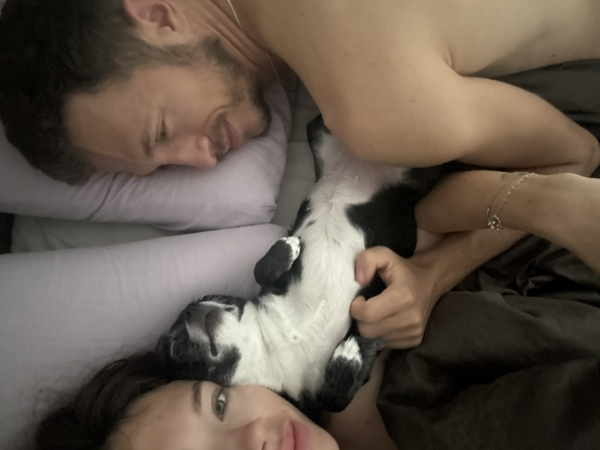 Couple shares morning moment with dog during Tel Aviv fog