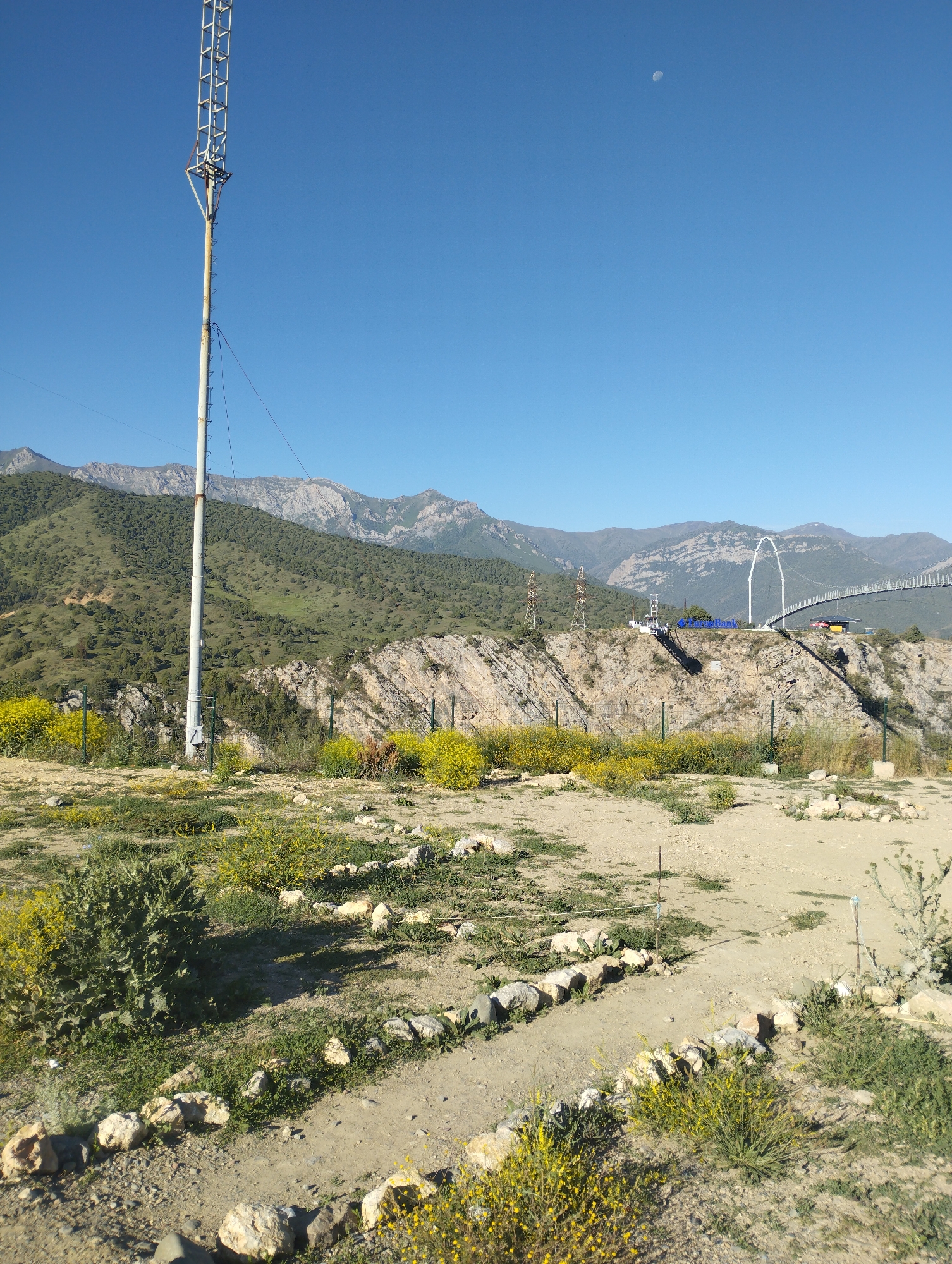 Morning light across Dardar's mountain roads, walkways, and valley views