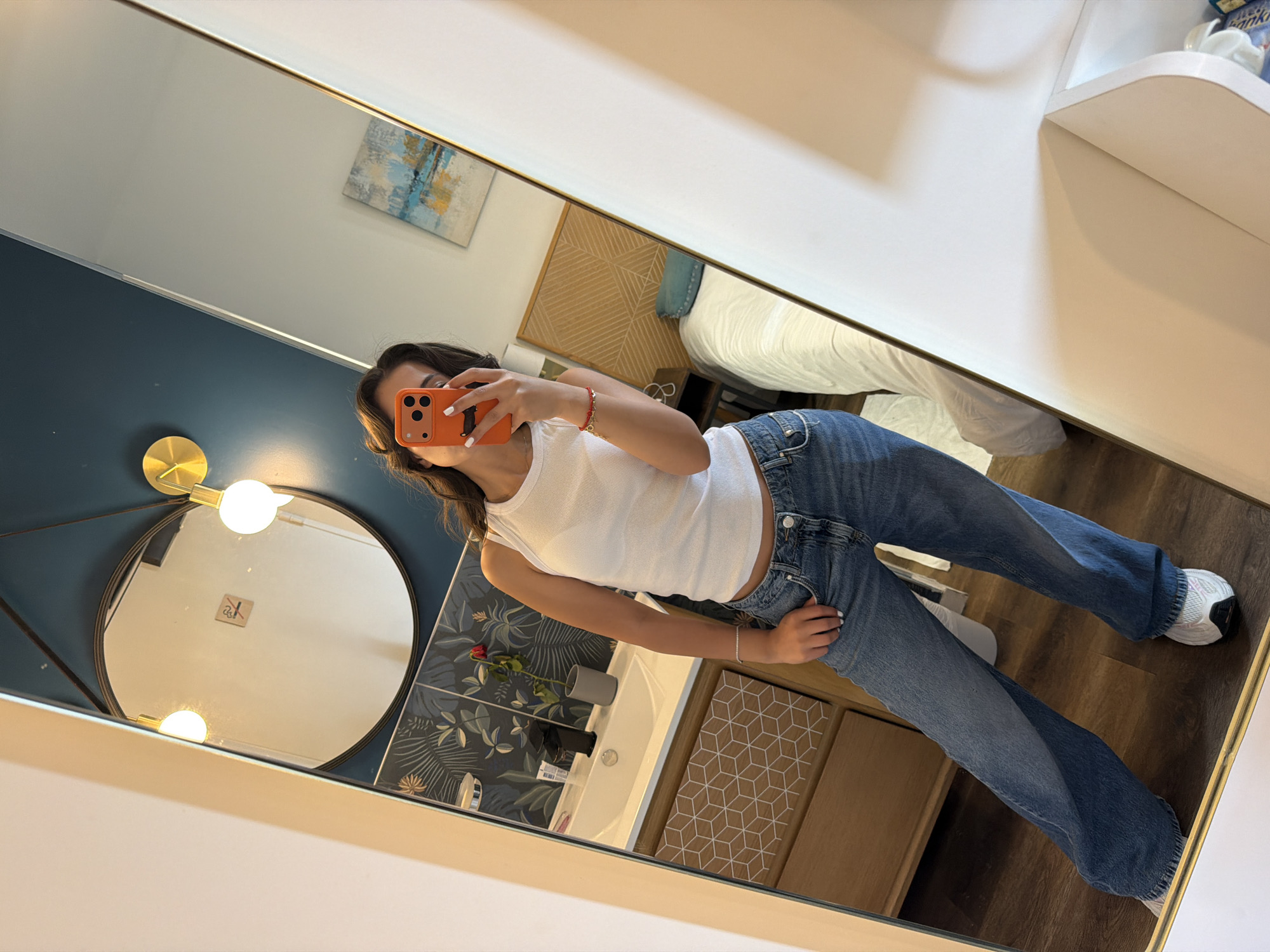 Woman takes morning mirror selfies in Cannes hotel room