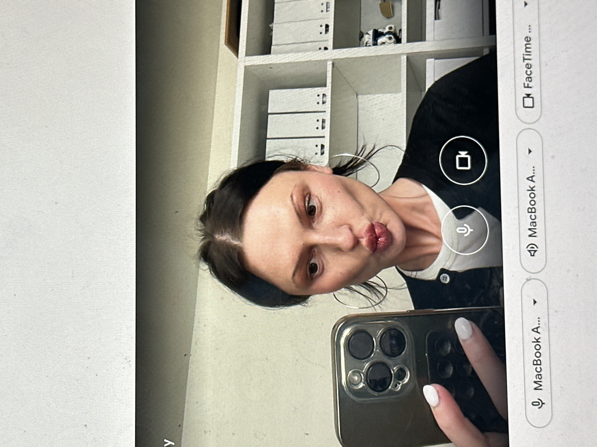 Woman takes selfie while on video call