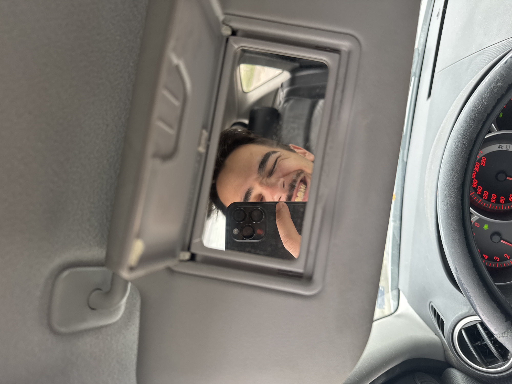 Driver takes selfie using sun visor mirror in Sofia