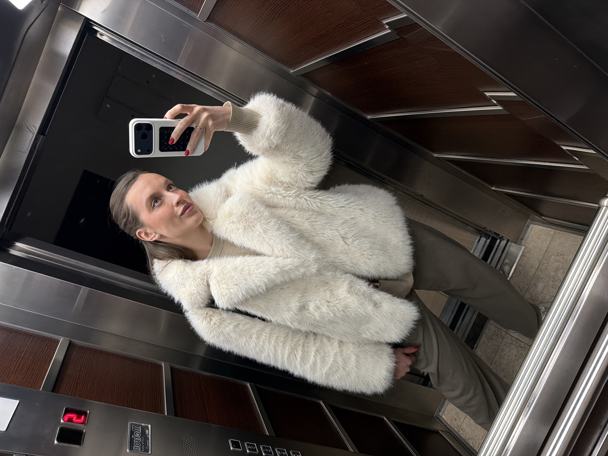 Woman takes elevator selfie in Budva, Montenegro
