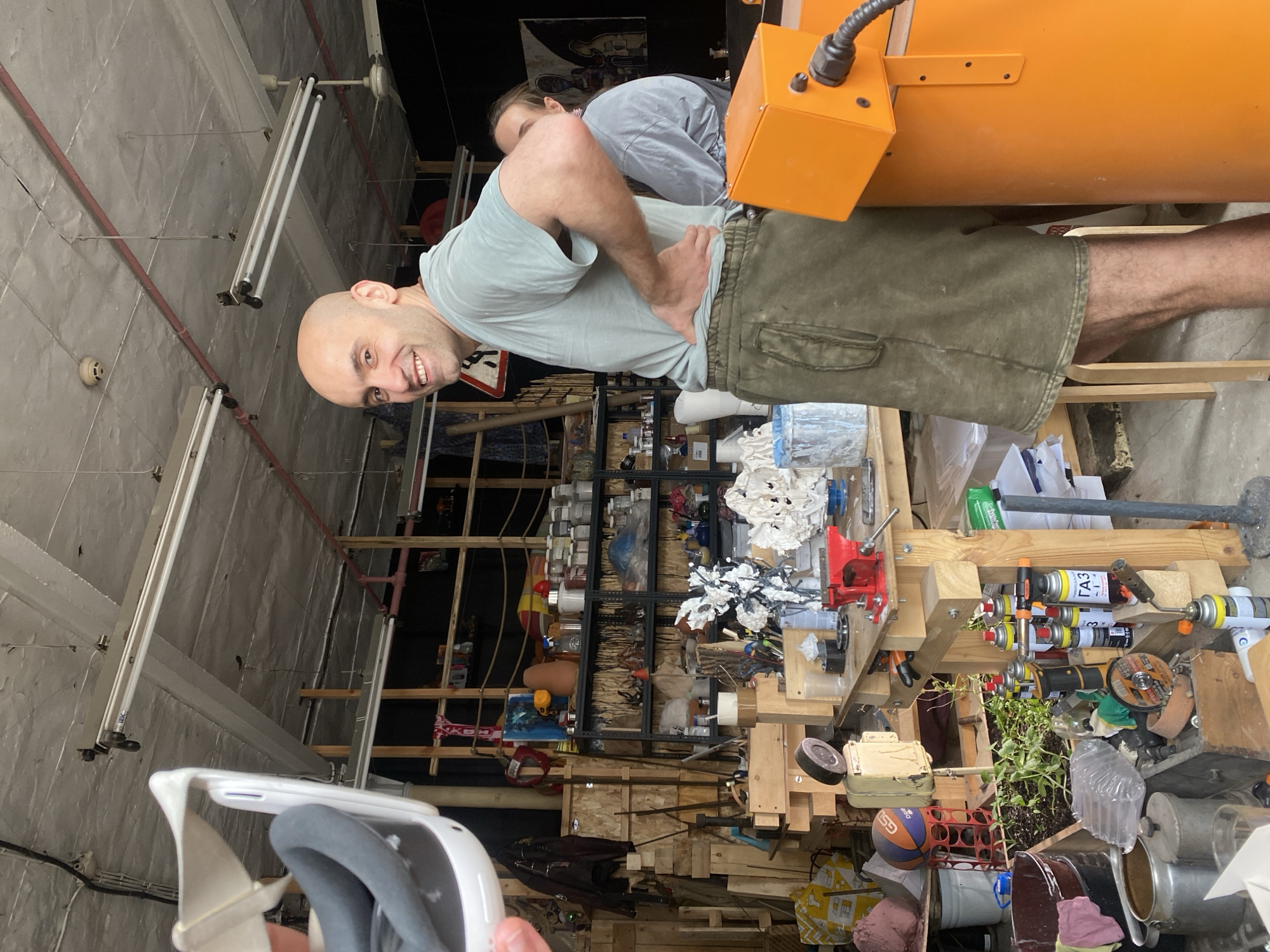 Man photographed smiling in Moscow workshop