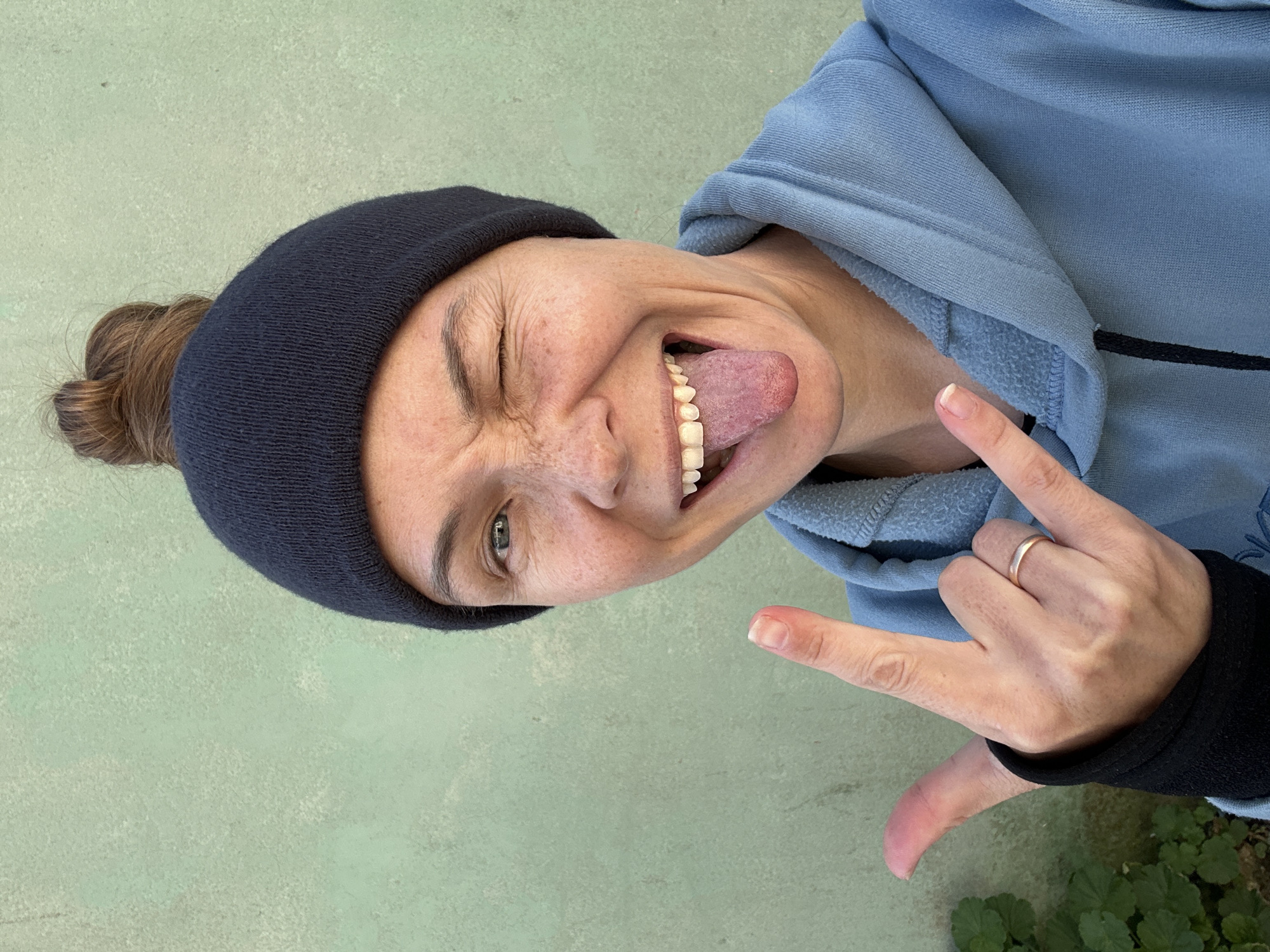 Woman makes playful face in Florianópolis street moment