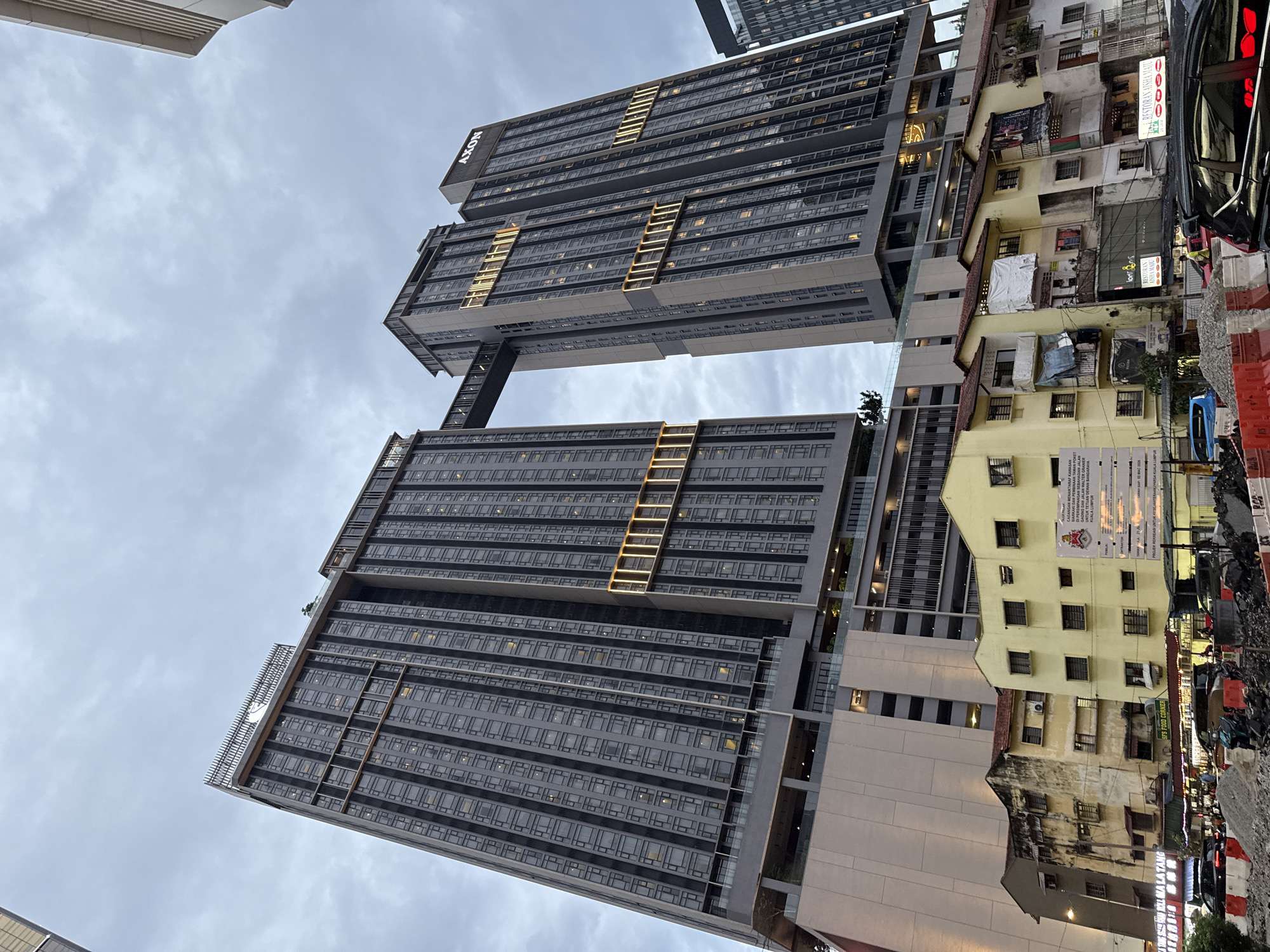 AXON-branded towers with sky bridge observed in Kuala Lumpur