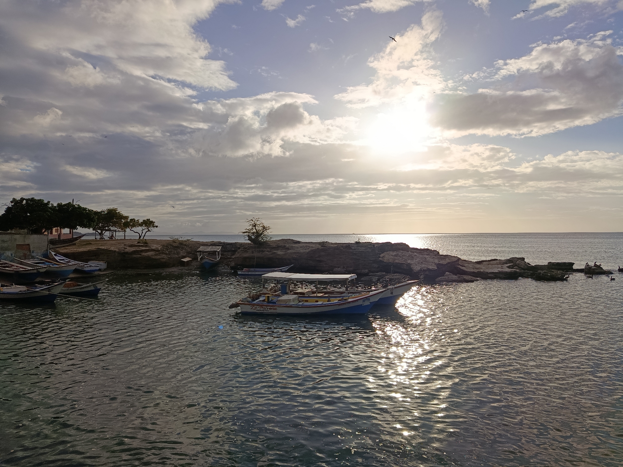 Golden sunset over the calm bay at Juan Griego
