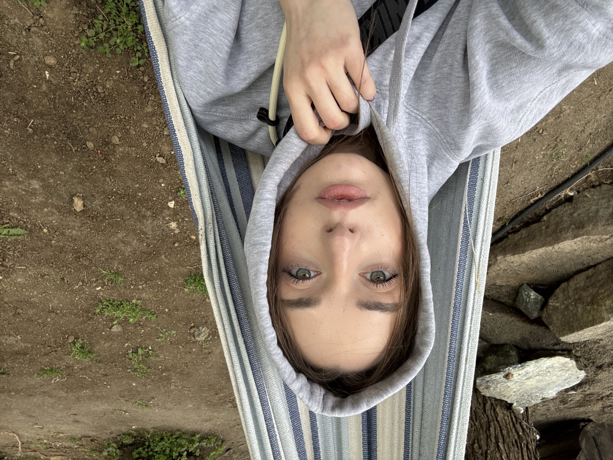 Young woman relaxes in hammock during outdoor break in Serbia