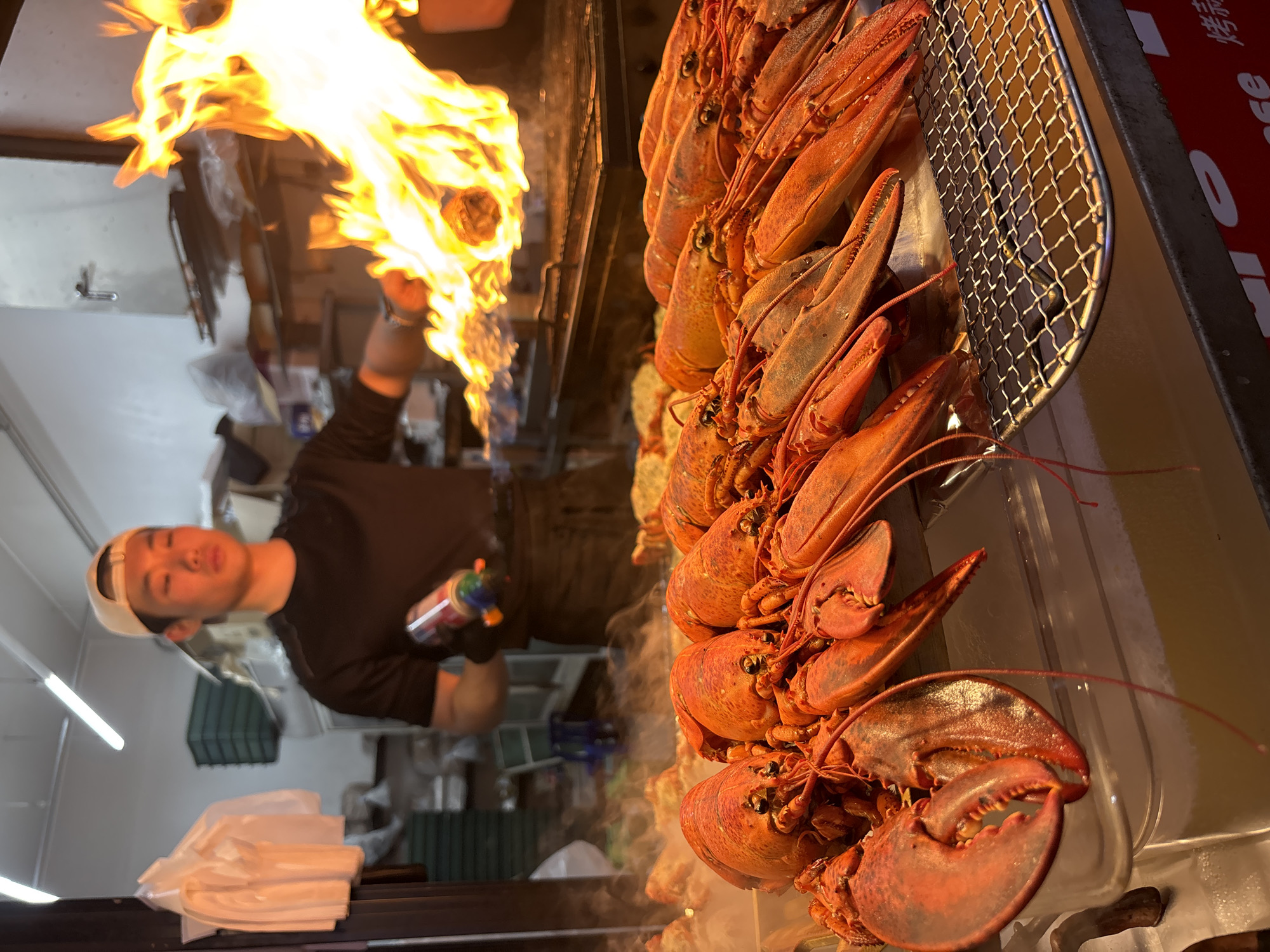 Busy street food market scene in Seogwipo-si, Jeju Island