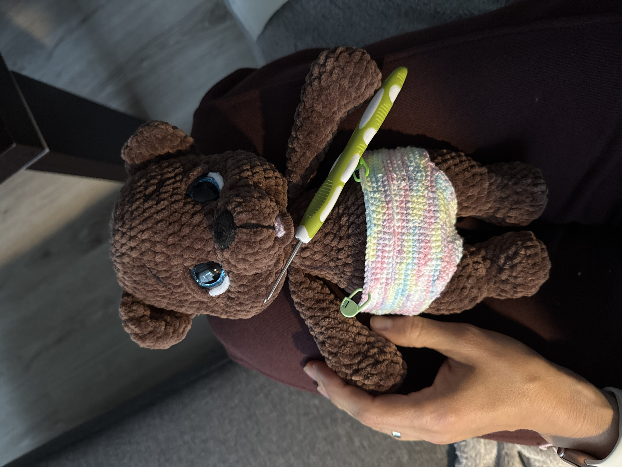 Crocheted teddy bear in a tiny diaper, Riga