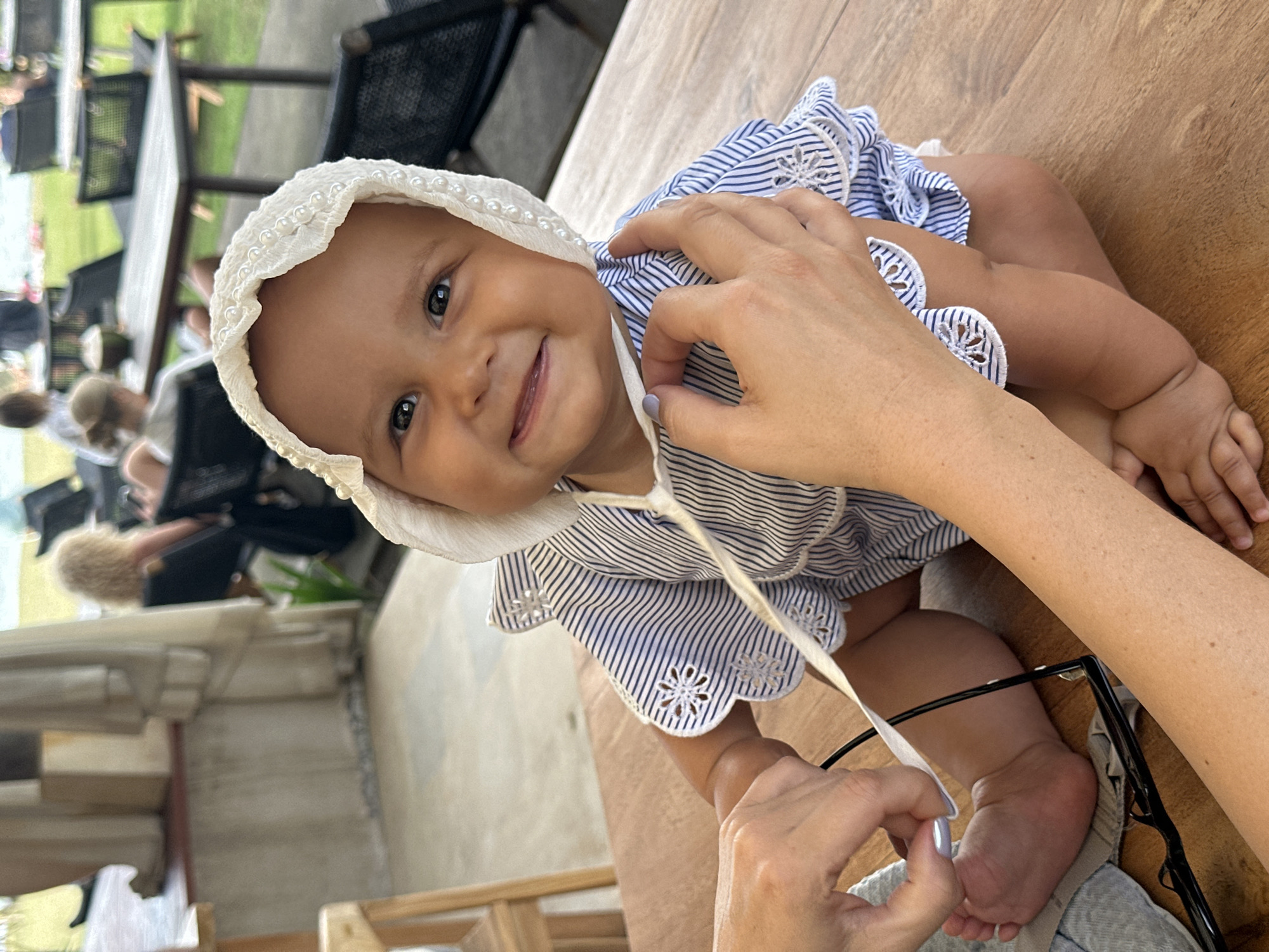 Baby and bandana dog at a Bali beachfront hangout