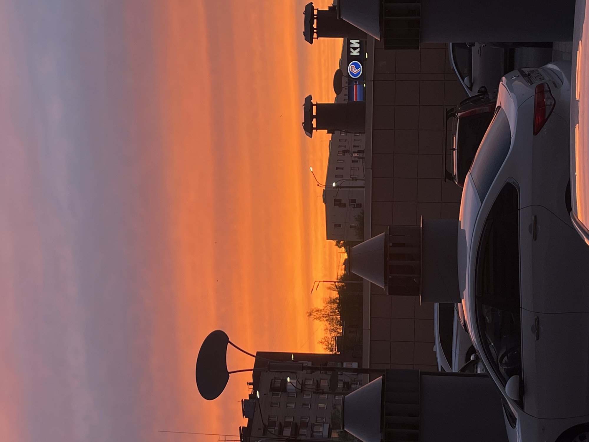 Evening sunset displays orange-pink hues over Saint Petersburg streets