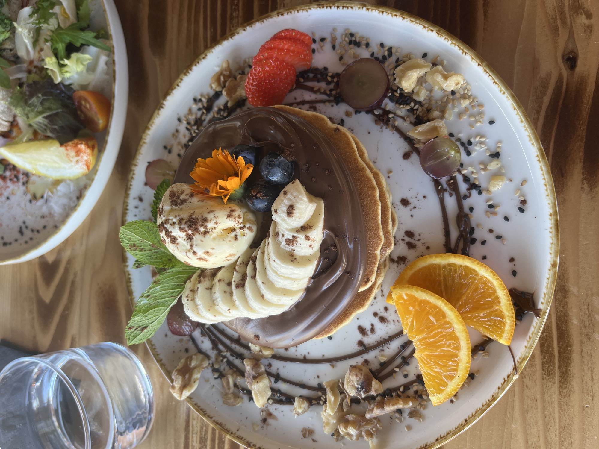 Elaborate fruit-topped chocolate pancakes photographed in Alicante