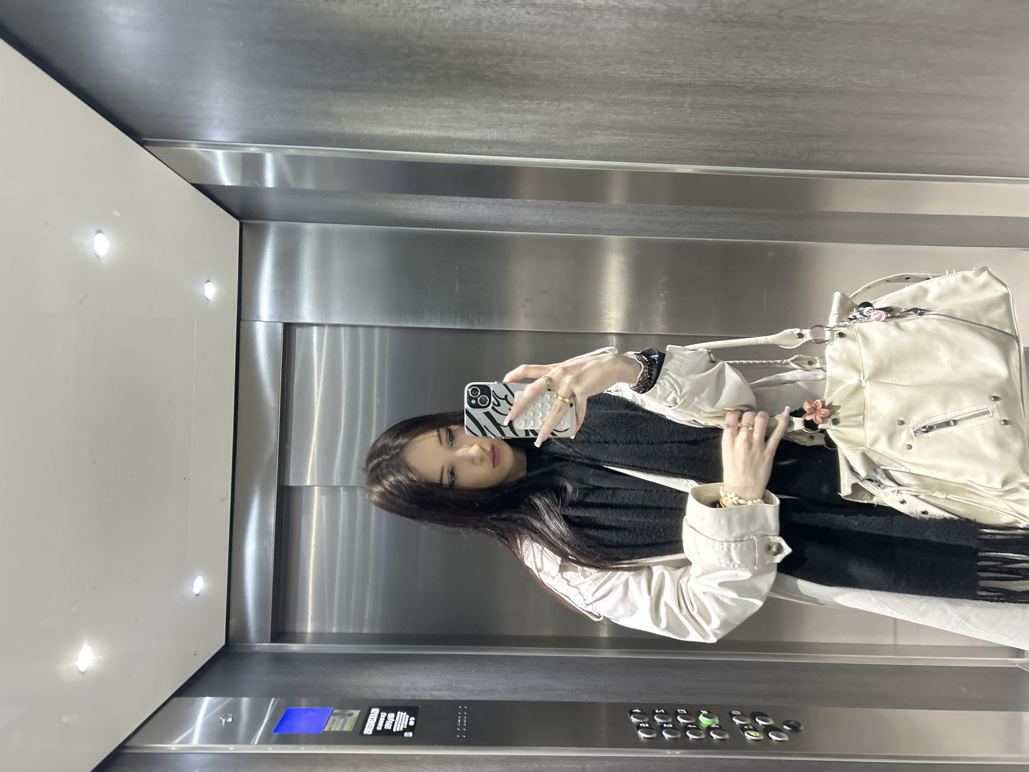 Woman takes elevator selfie in Cachan, France