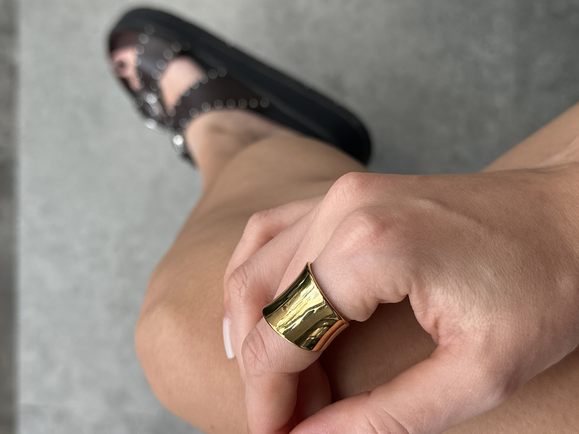 Man gets late-night manicure while browsing phone in Indonesian salon