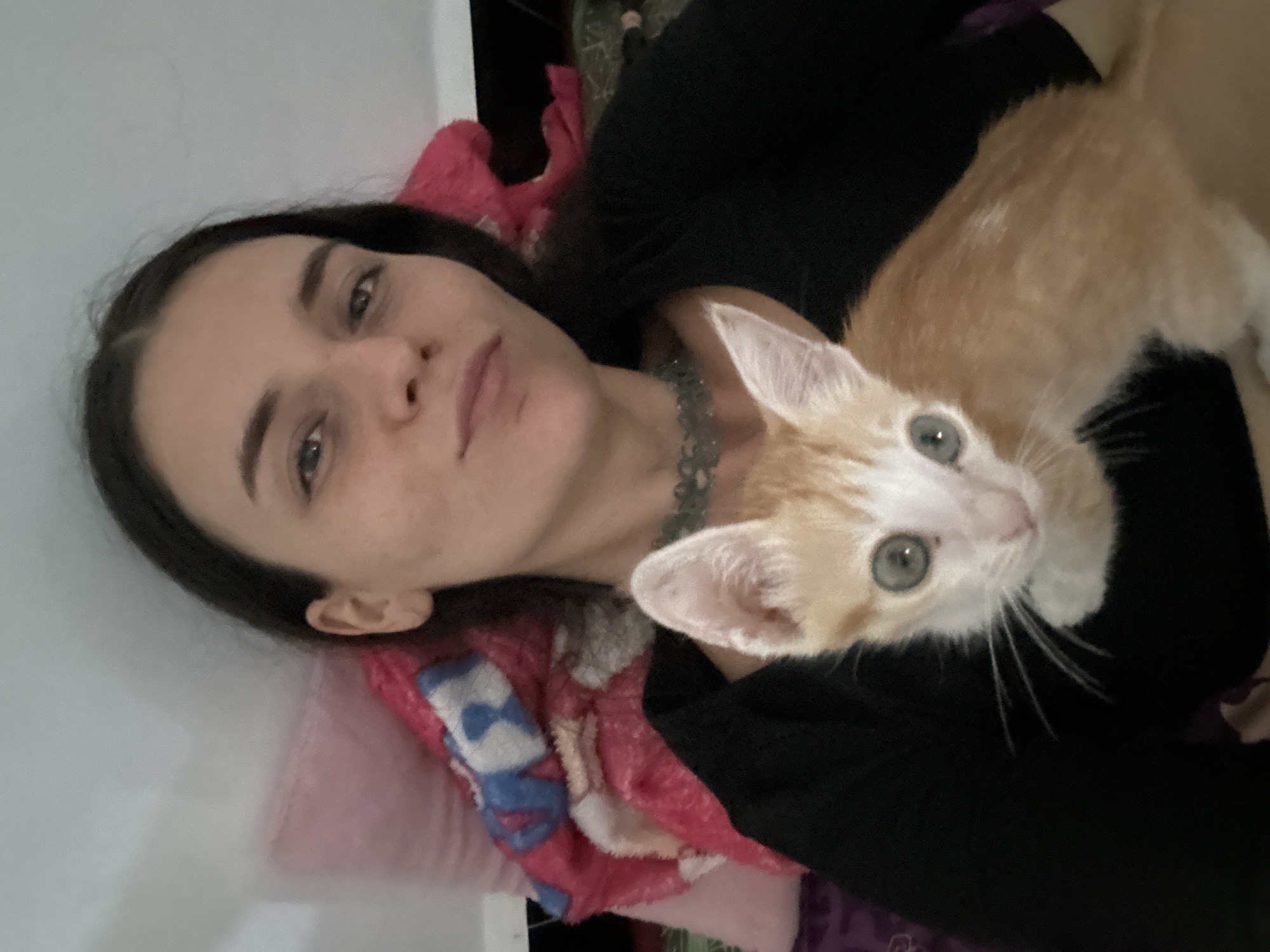 Woman and kitten rest together in Mũi Né home