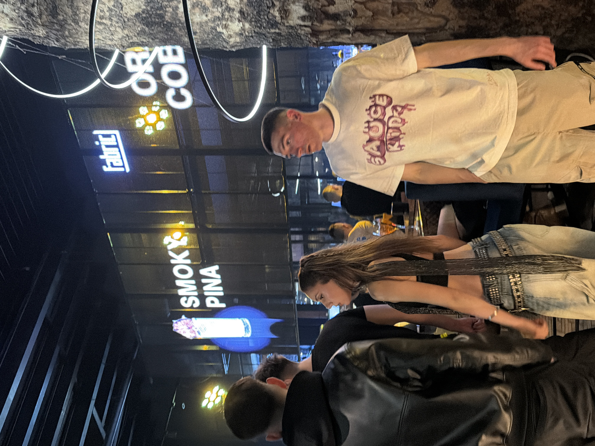 Social gathering captured at dimly lit venue in Burgas