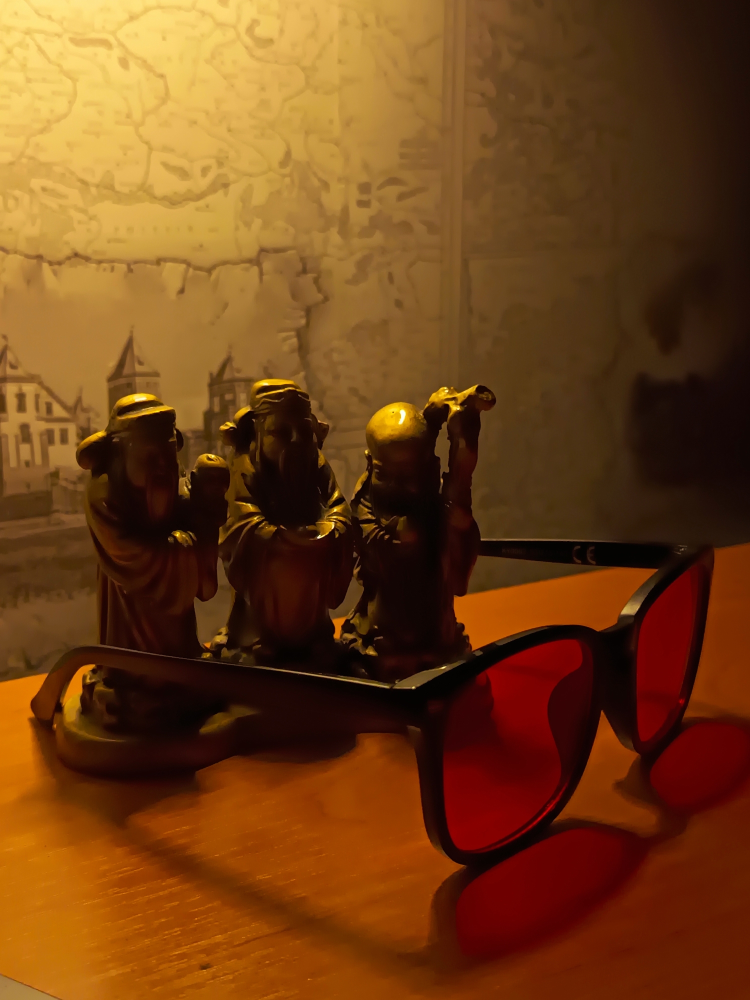 Red-lensed sunglasses and a digital watch arranged in Izmail