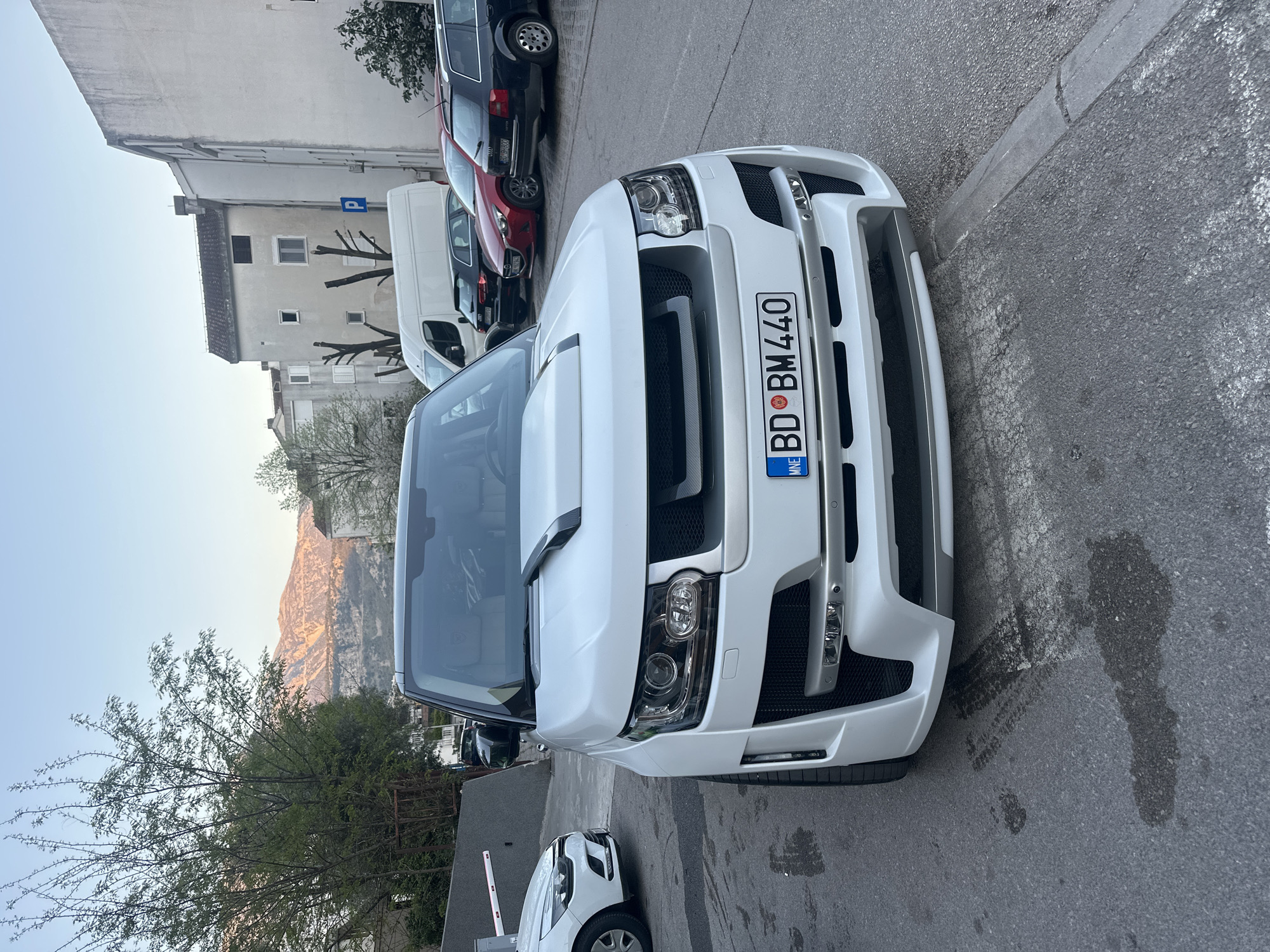 Woman in pink sweatshirt observed in vehicle in Budva